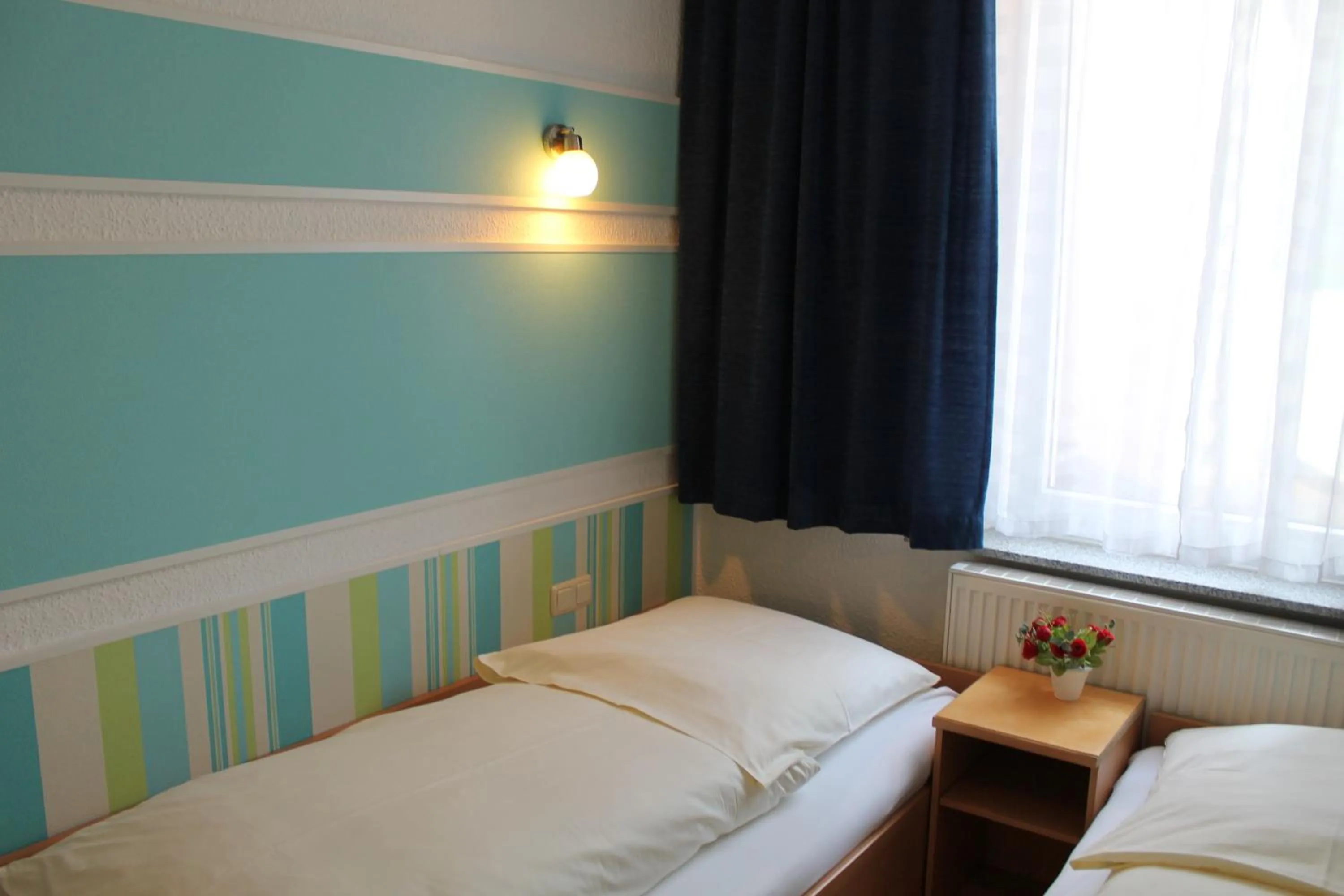 Bed in Pension Central Nuernberg-Fuerth