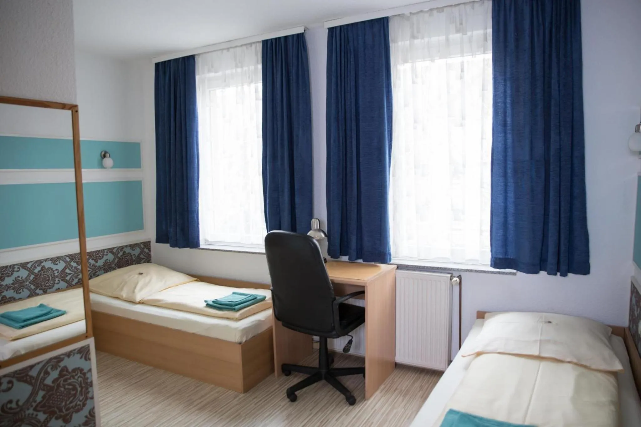 Bed in Pension Central Nuernberg-Fuerth