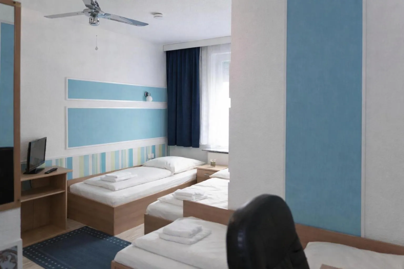 Photo of the whole room, Bed in Pension Central Nuernberg-Fuerth
