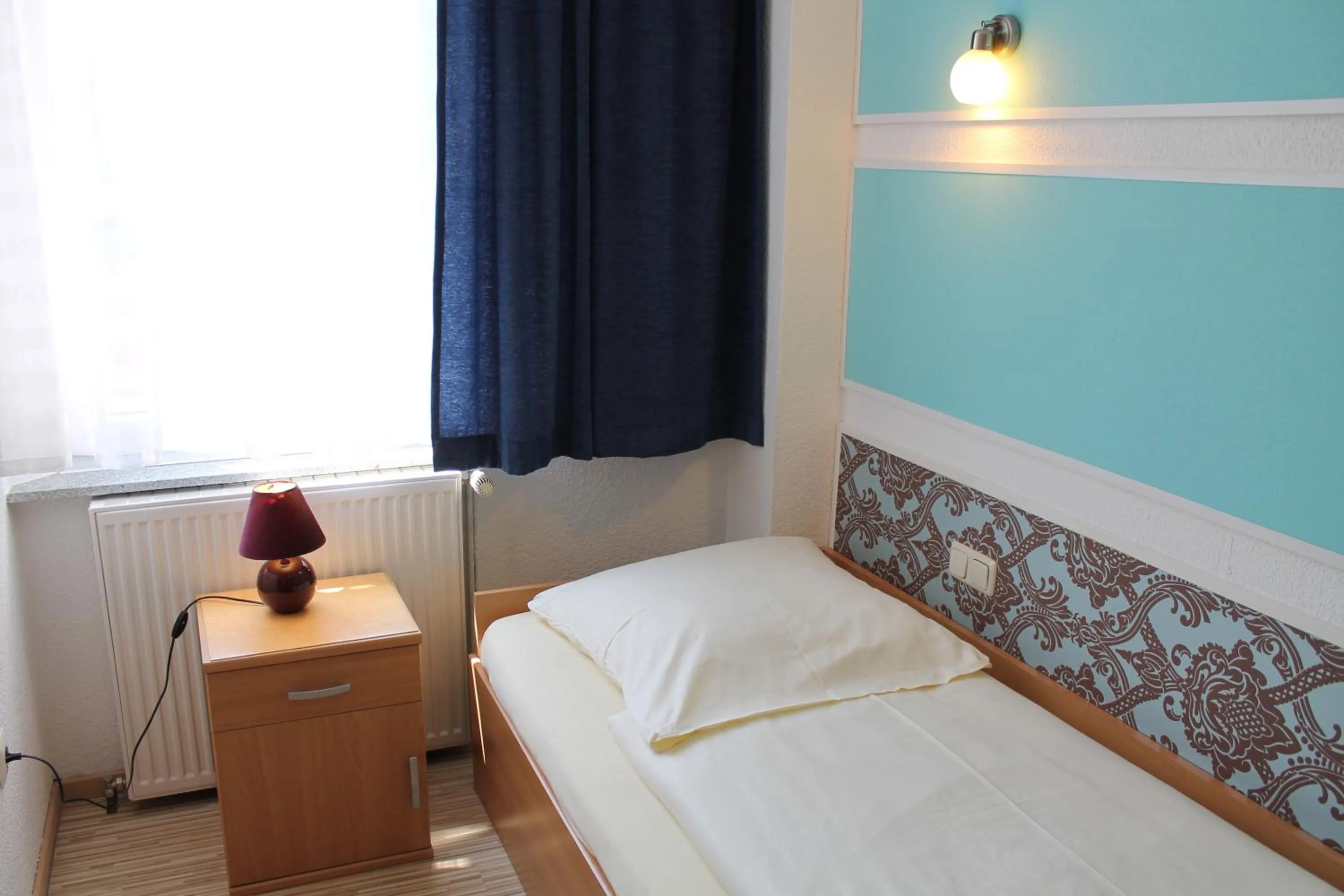 Bed in Pension Central Nuernberg-Fuerth