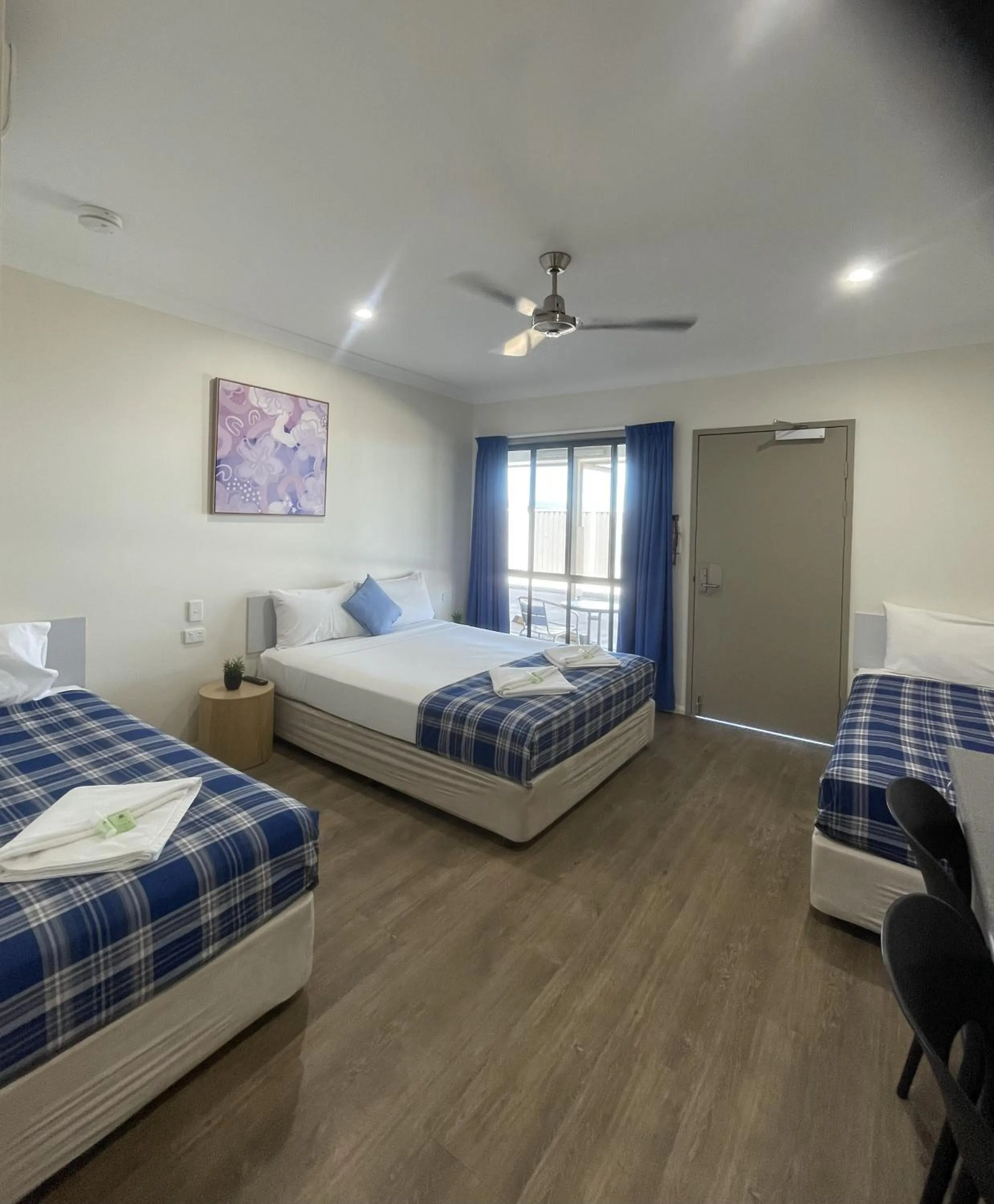 Bed in Reef Gardens Motel