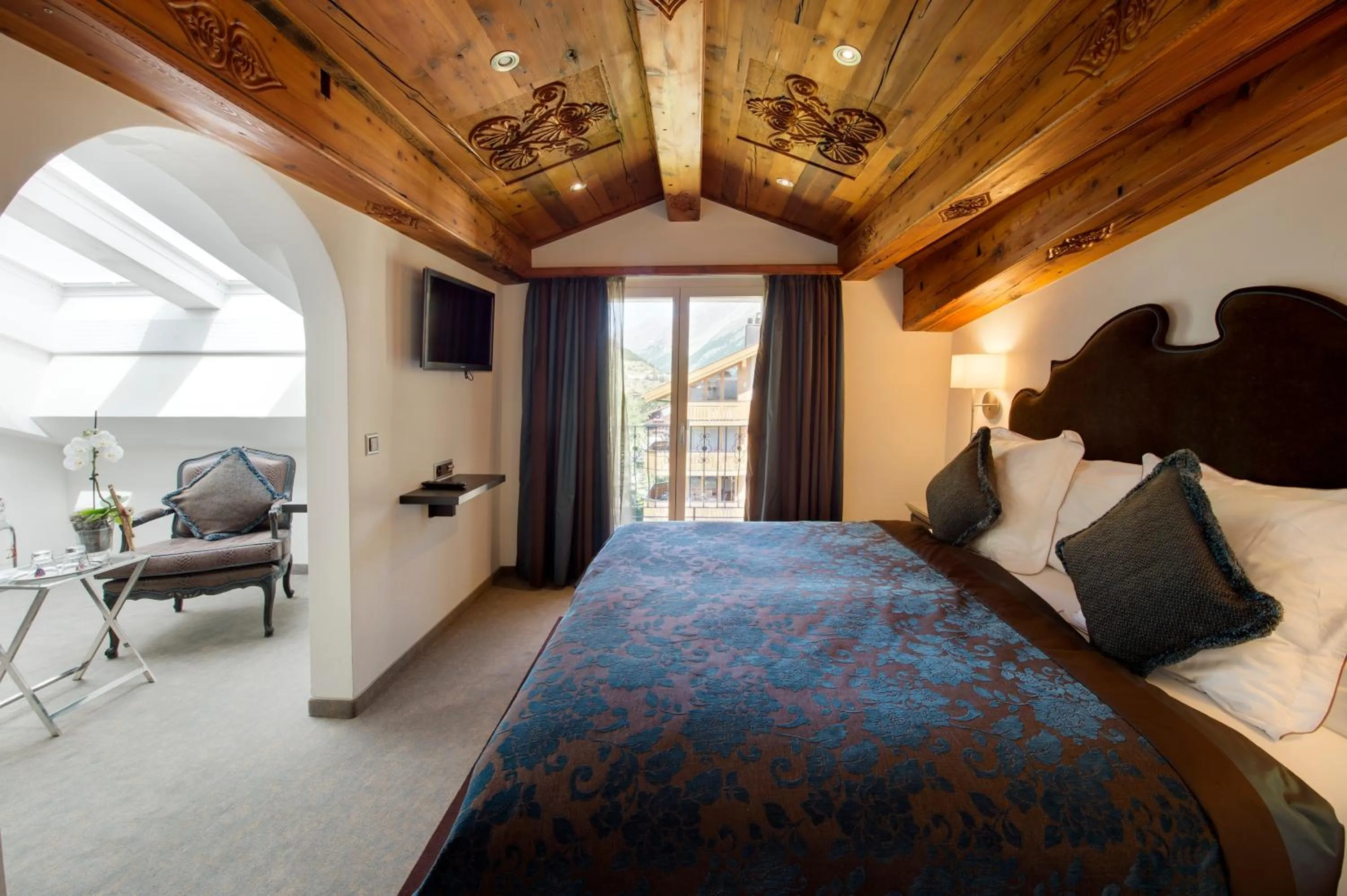 Bed in SchlossHotel Zermatt Active & CBD Spa Hotel