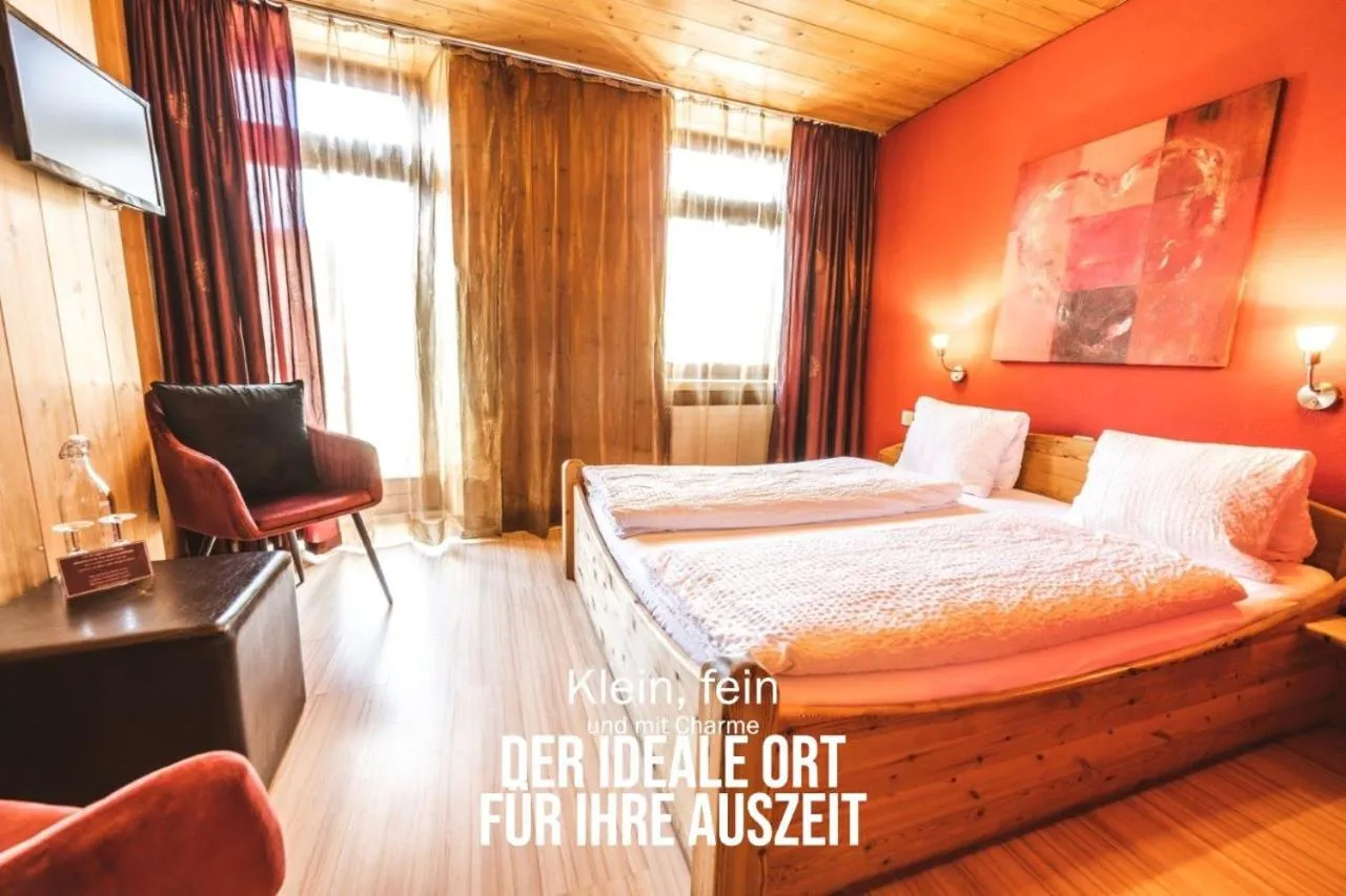 Bed in CURUNA Pensiun-Frühstückspension