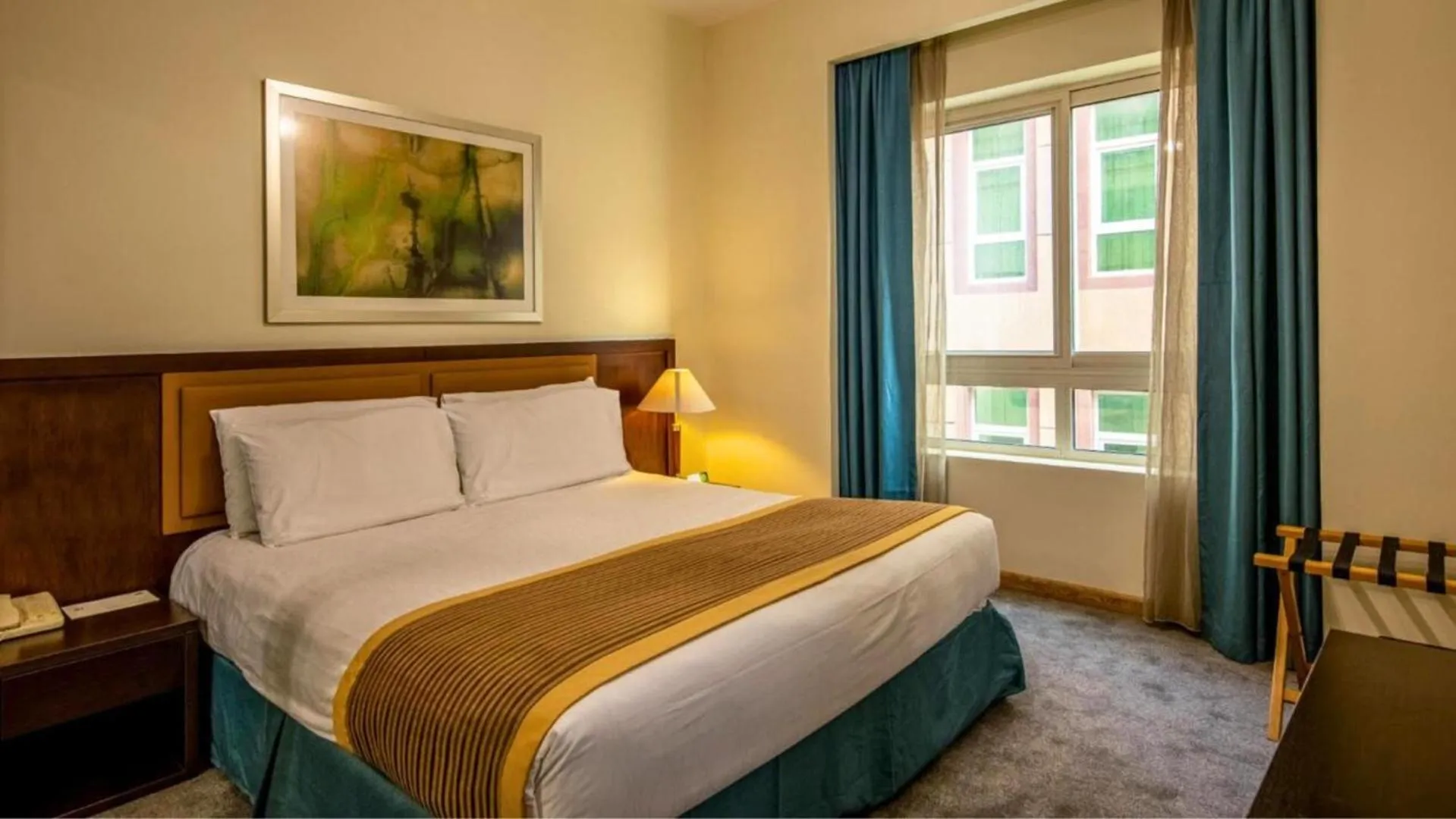 Bed in TIME Ruby Hotel Apartment