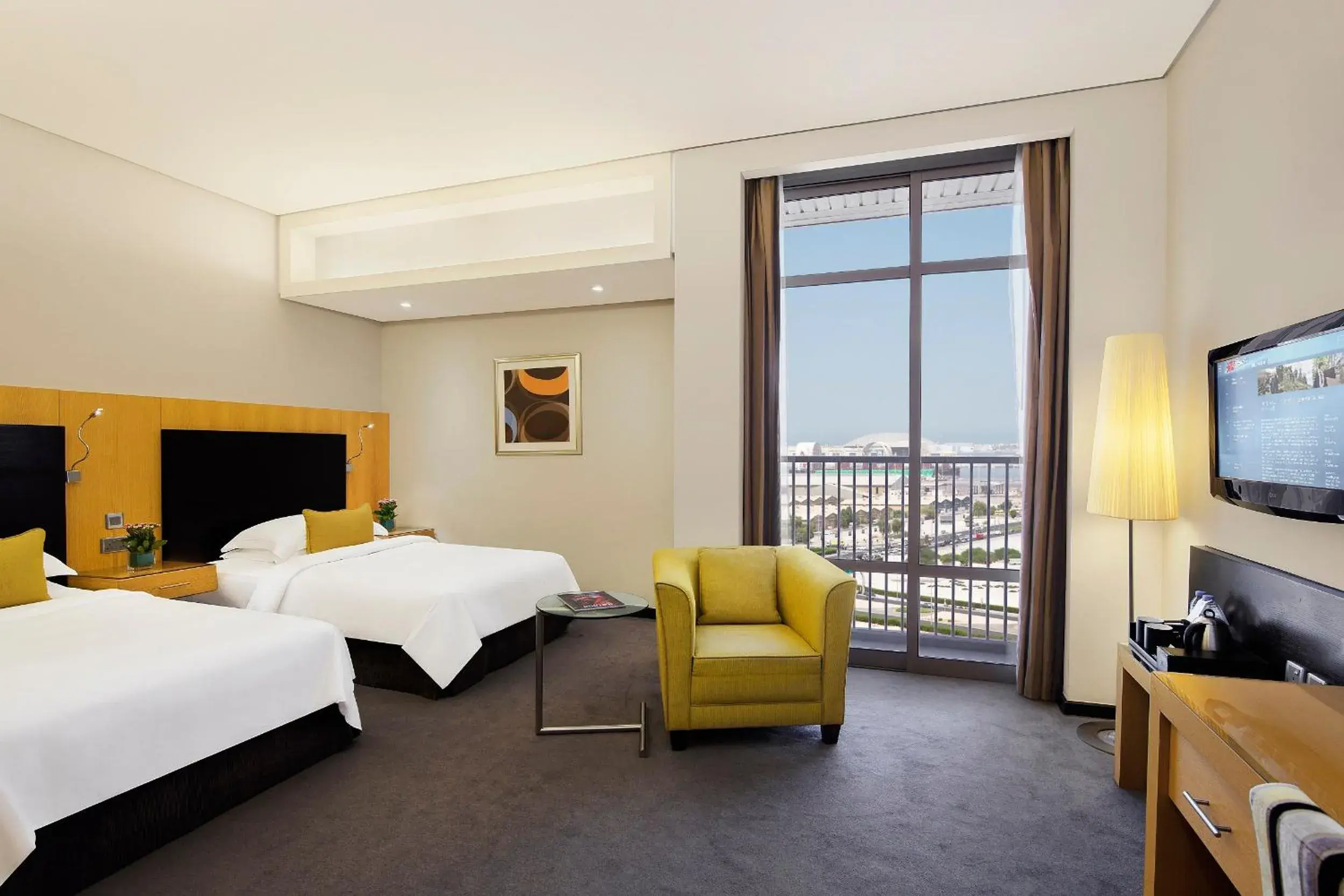 Balcony/Terrace, Bed in Hala Arjaan by Rotana, Deluxe Hotel Apartments Balcony/Terrace, Bed in Hala Arjaan by Rotana, Deluxe Hotel Apartments