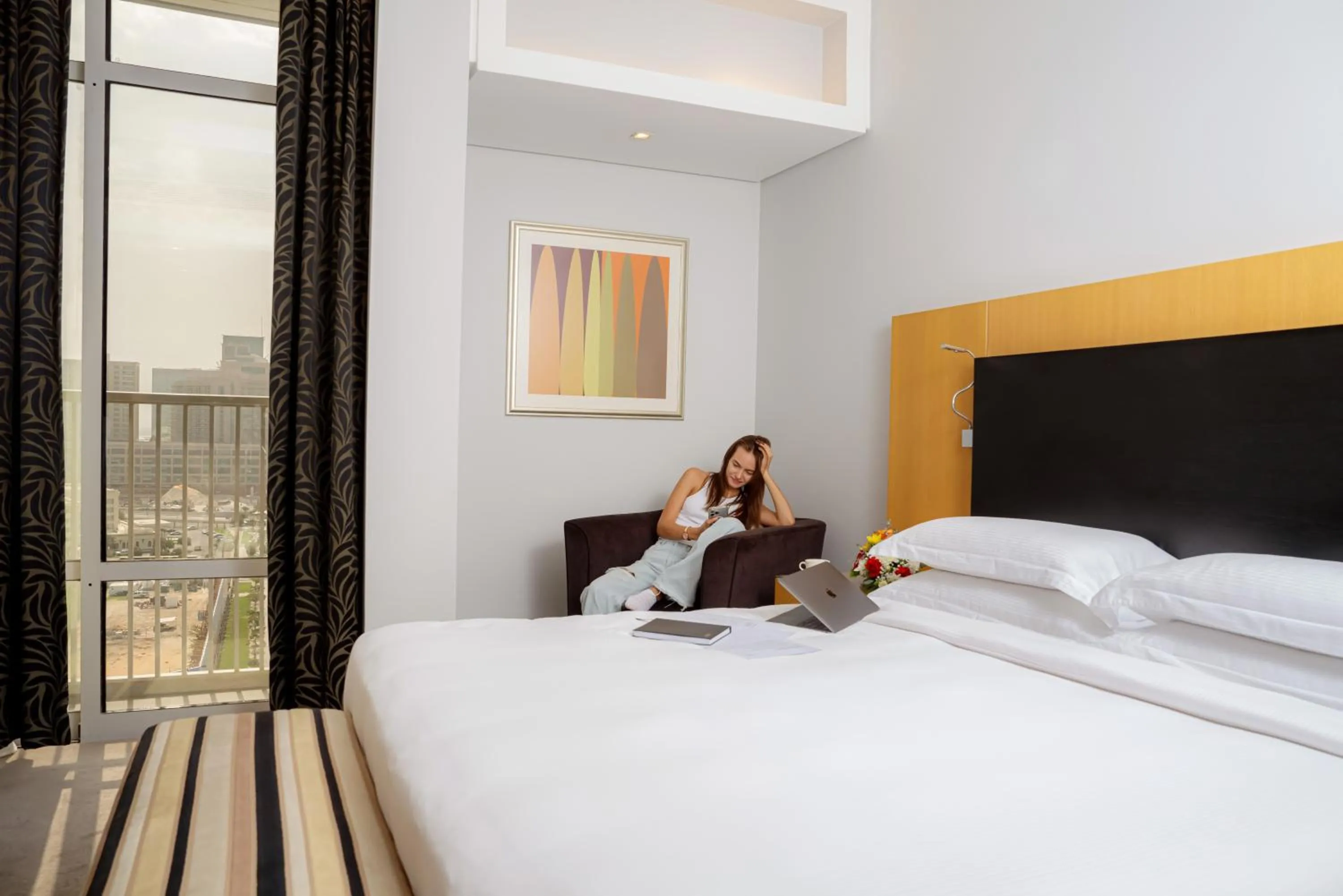 Bed in Hala Arjaan by Rotana, Deluxe Hotel Apartments