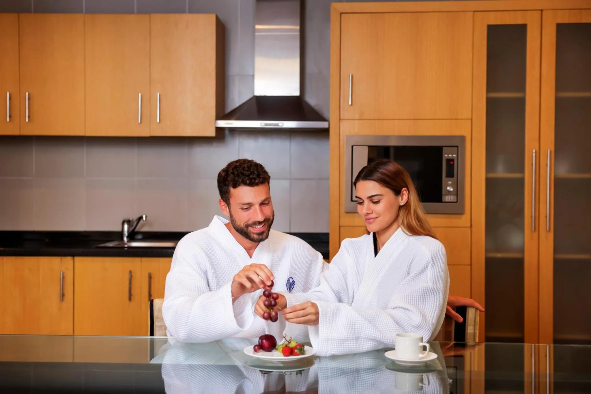 Kitchen or kitchenette in Hala Arjaan by Rotana, Deluxe Hotel Apartments