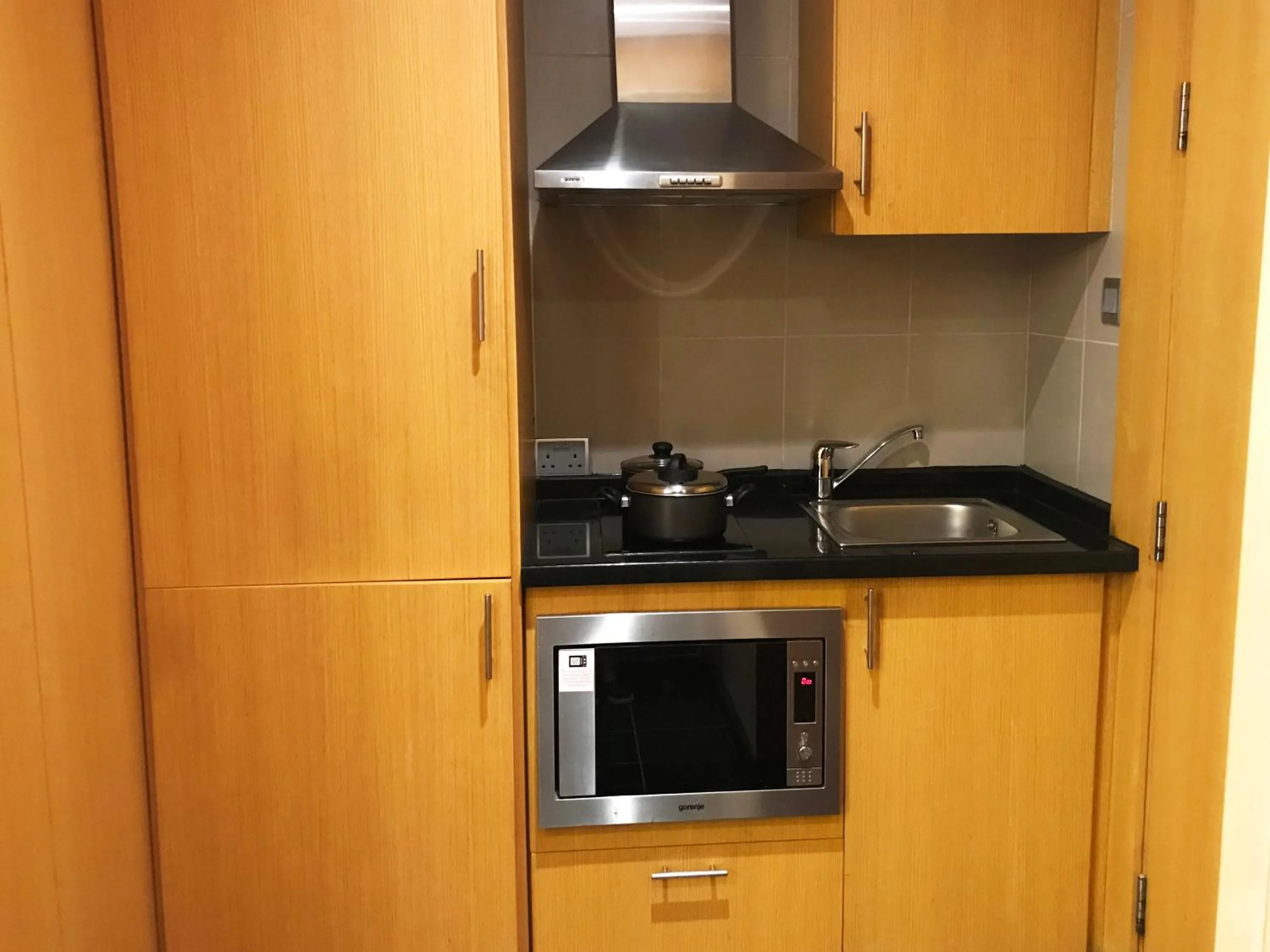 kitchen in Hala Arjaan by Rotana, Deluxe Hotel Apartments