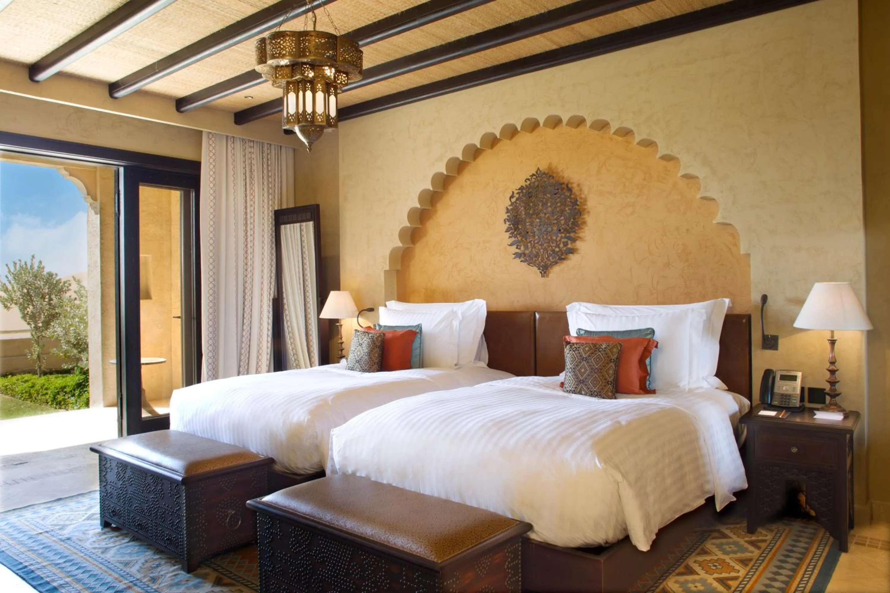 Bed in Anantara Qasr al Sarab Desert Resort