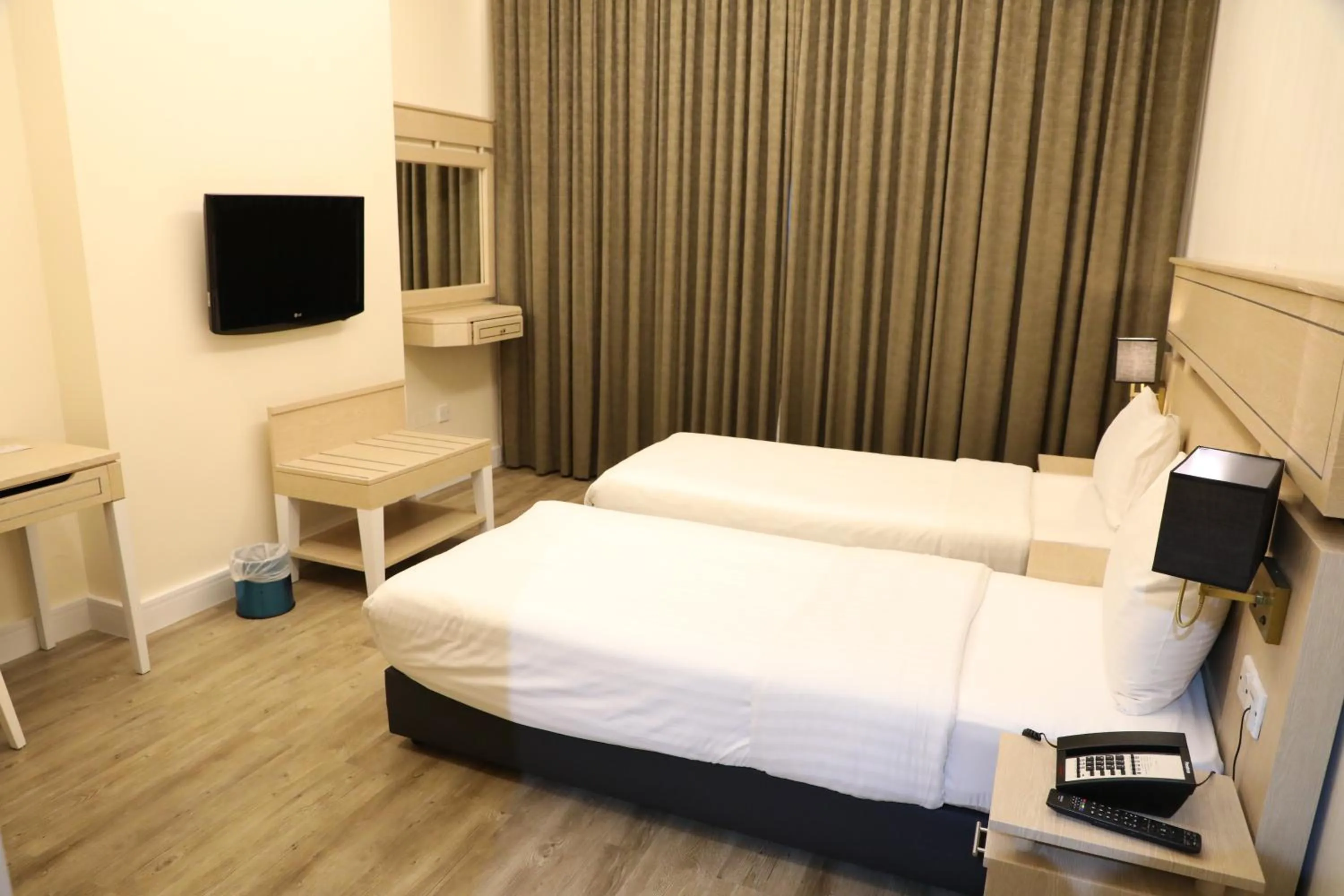 Bed in Wescott Plaza Hotel Apartments LLC Formerly West Zone Plaza Hotel Apts