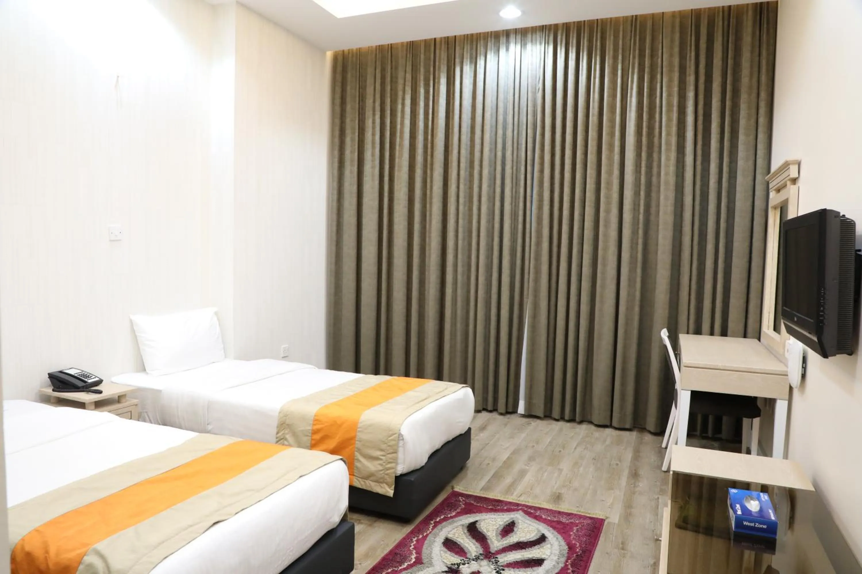 Bed in Wescott Plaza Hotel Apartments LLC Formerly West Zone Plaza Hotel Apts