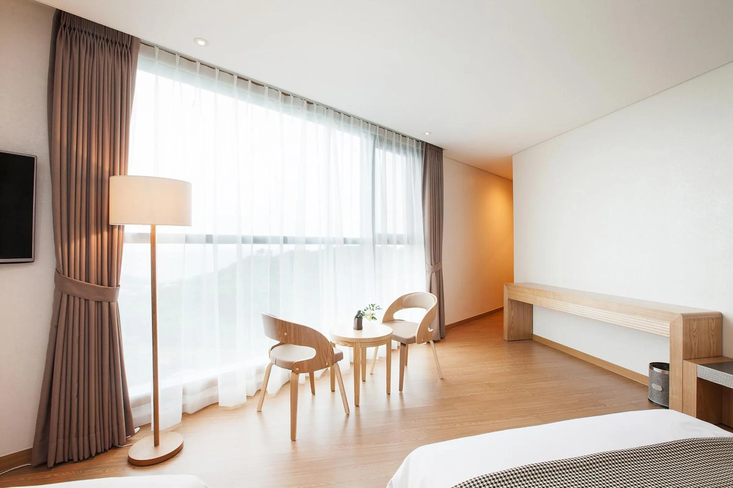 Seating area, Bed in YOUUS Hotel