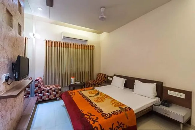 Bed in Hotel Rajmandir