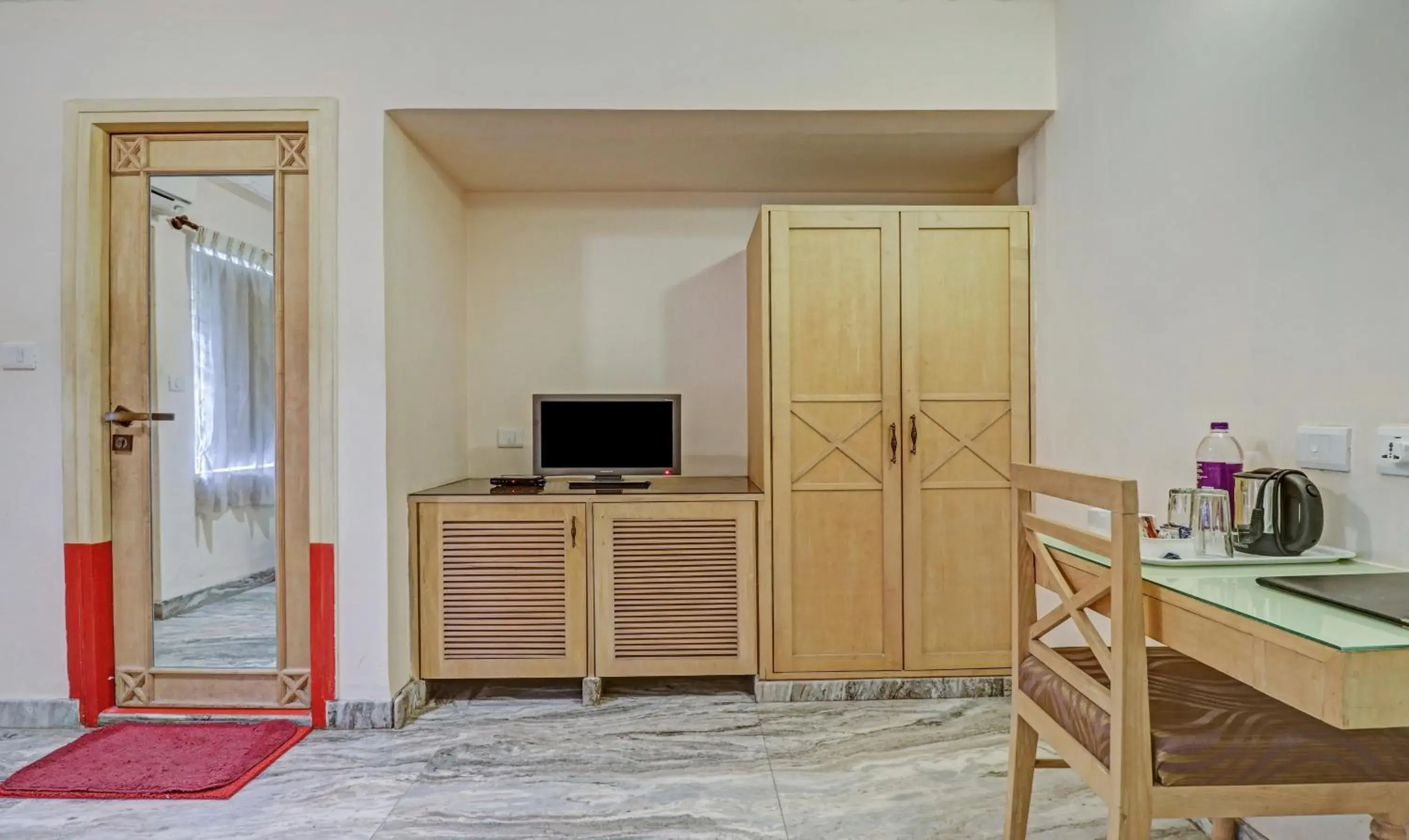 Bedroom in Treebo Komfort Suites, 3 Km From Mysore Palace Bedroom in Treebo Komfort Suites, 3 Km From Mysore Palace