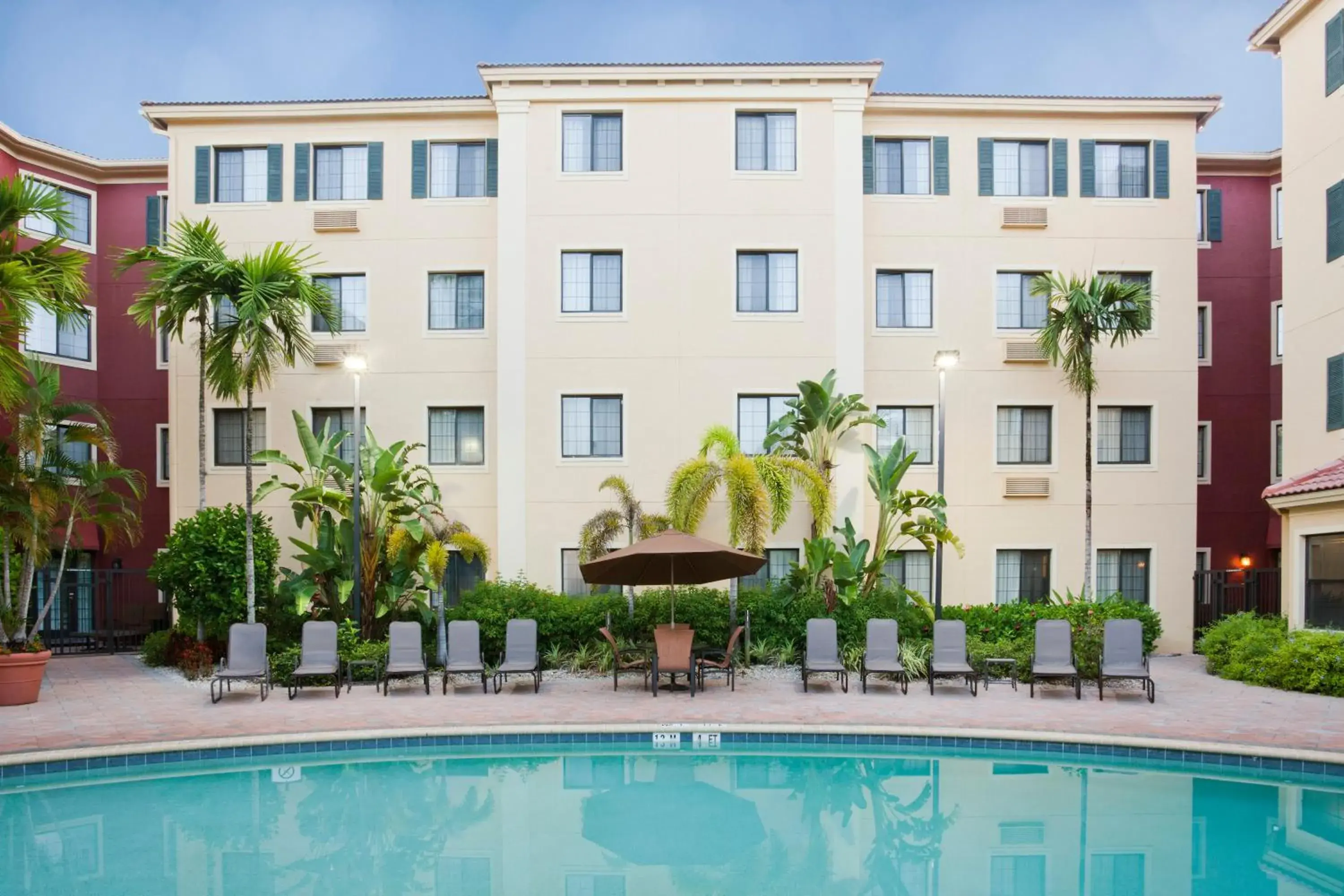 Swimming pool, Property Building in Staybridge Suites Naples - Gulf Coast, an IHG Hotel