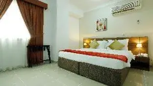 Bed in La Villa Inn Hotel Apartment Bed in La Villa Inn Hotel Apartment