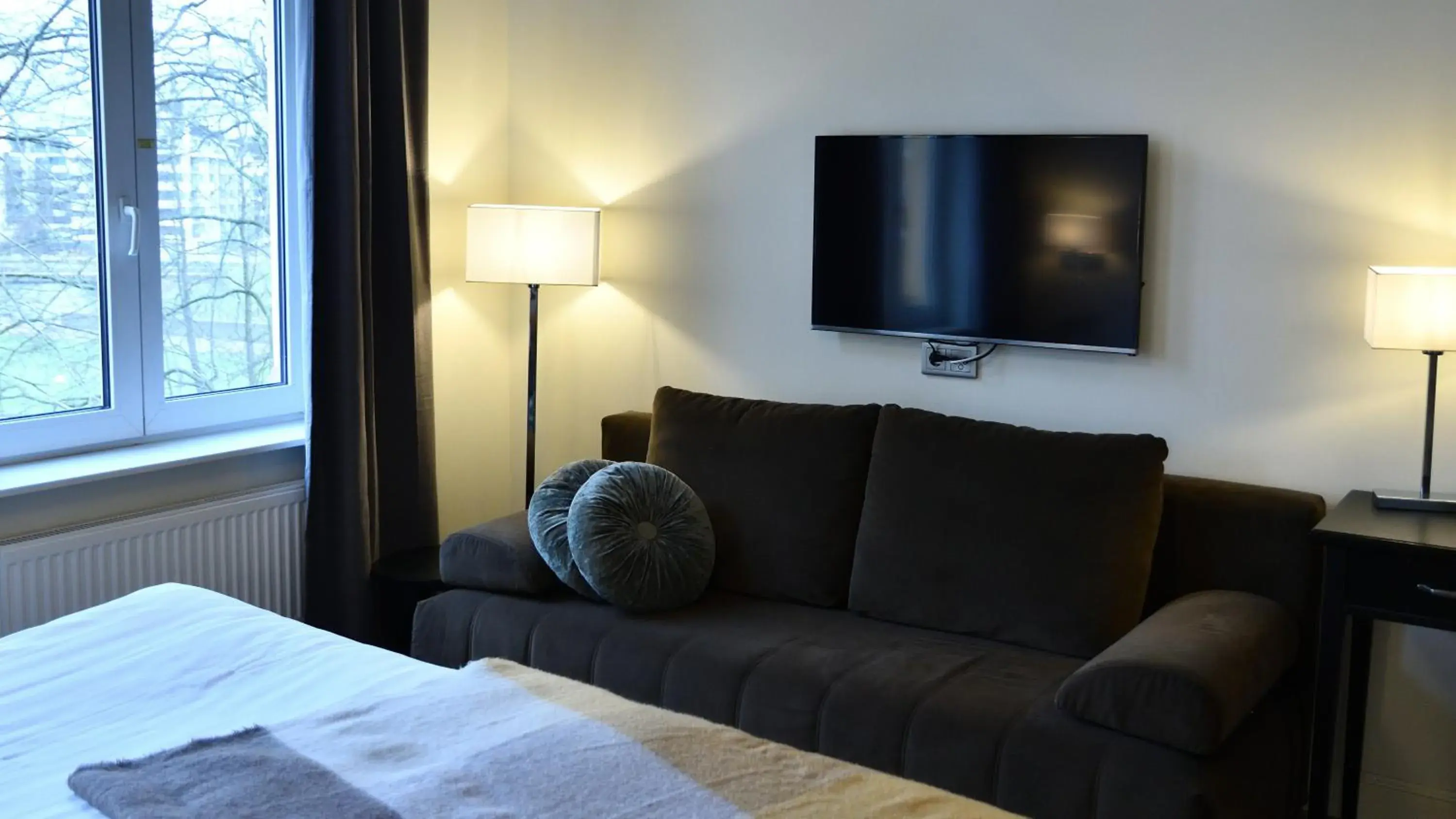 Communal lounge/ TV room, Bed in Home Hotel Norre Park Communal lounge/ TV room, Bed in Home Hotel Norre Park