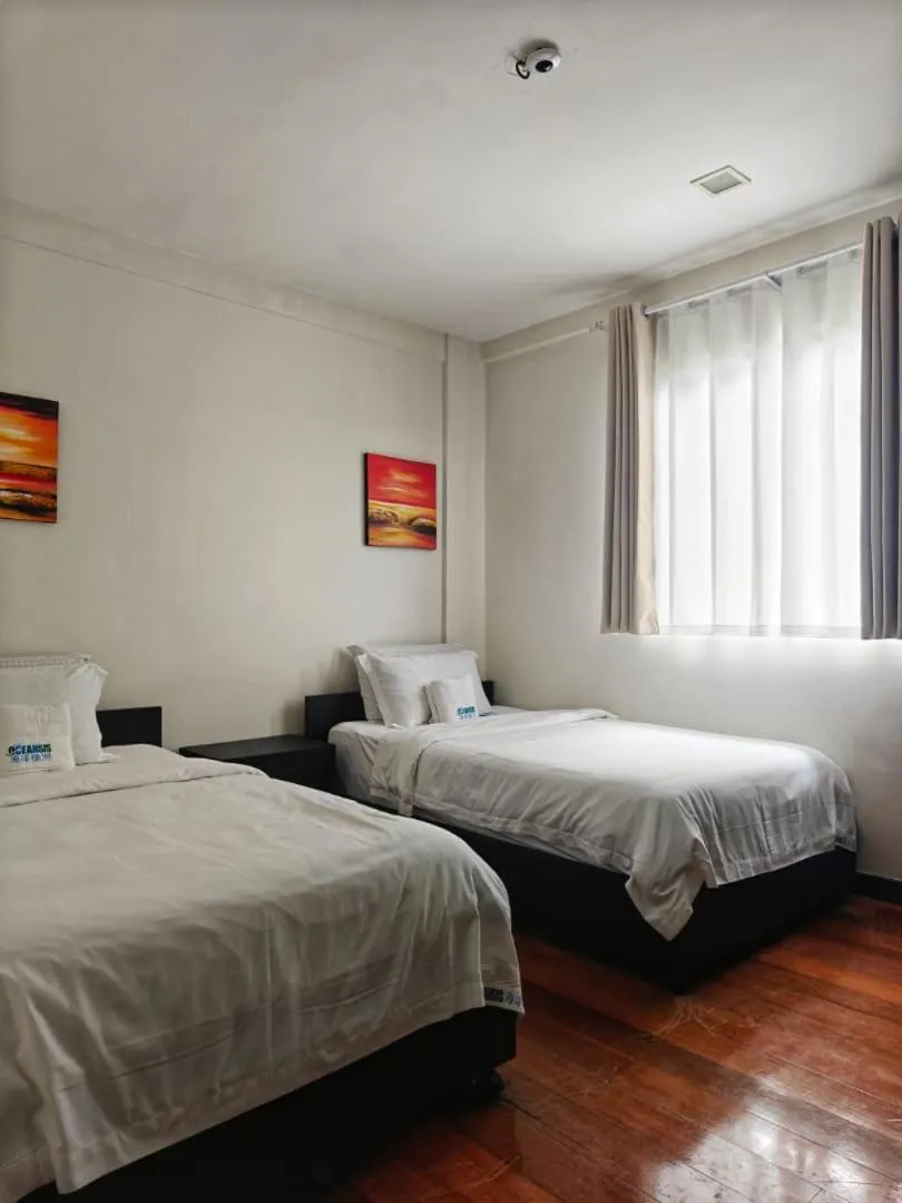 Bed in Sabah Beach Villas & Suites