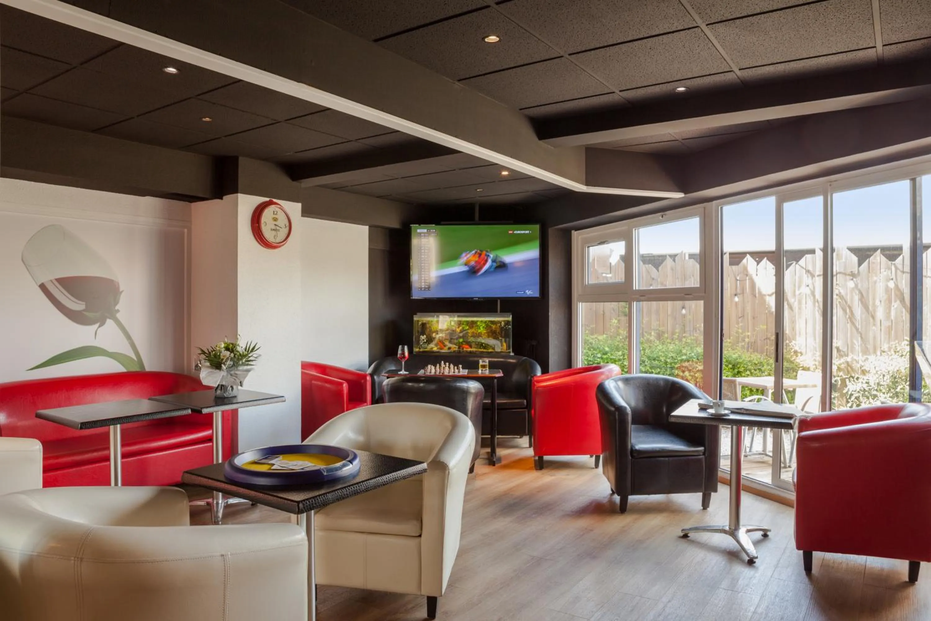 Communal lounge/ TV room in Kyriad Direct Rennes Ouest