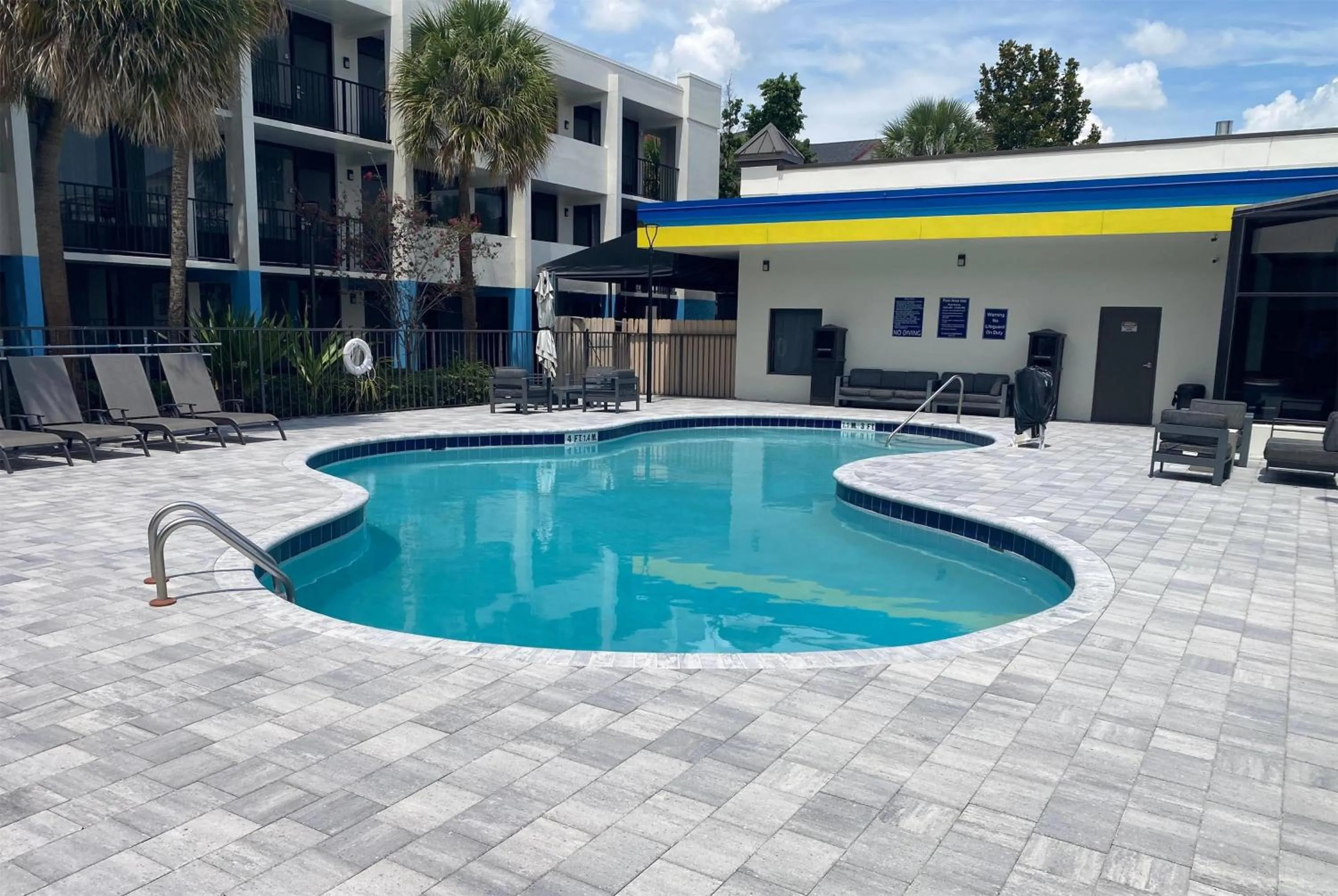 Pool view in Days Inn & Suites by Wyndham Orlando Airport