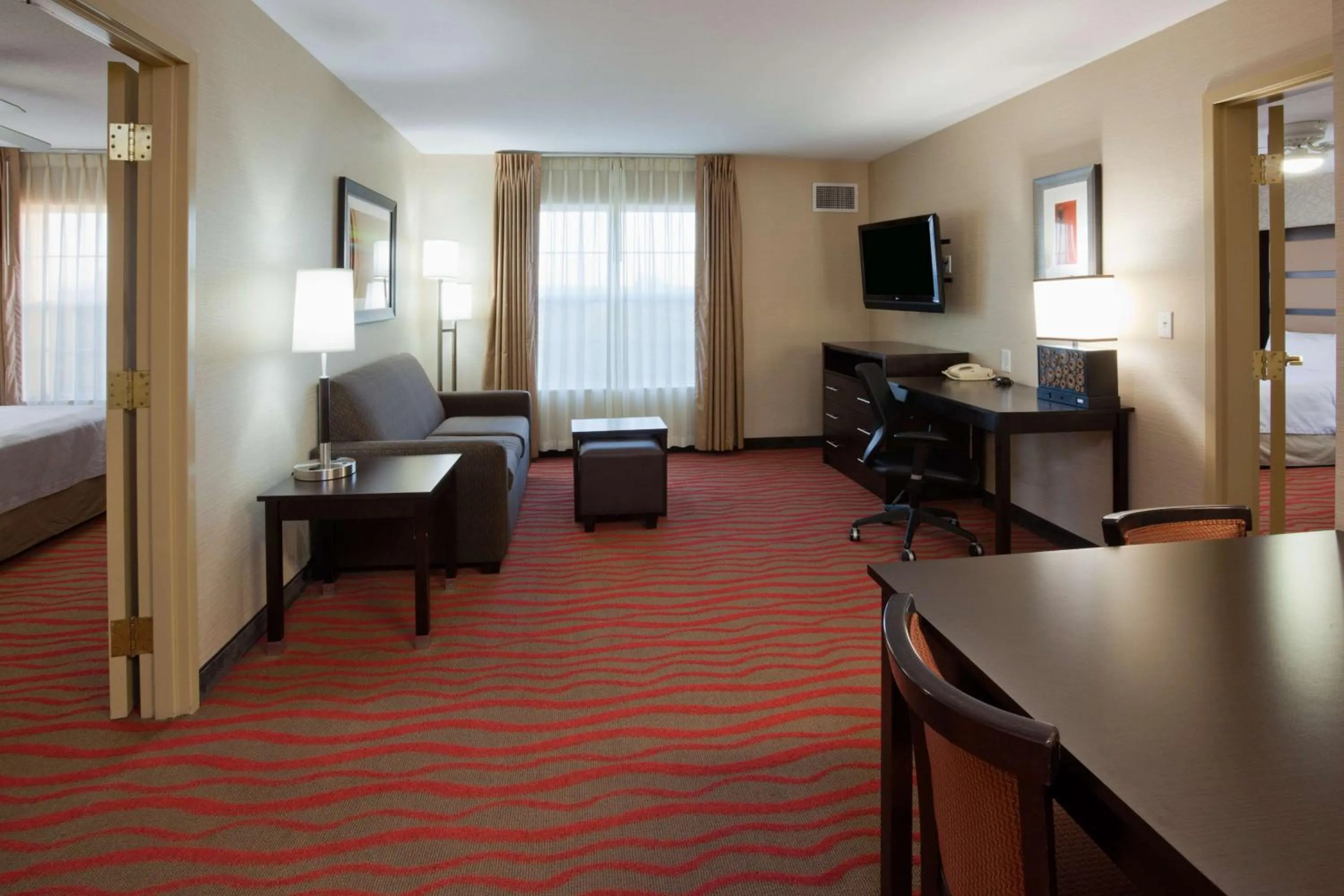 Living room, Bed in Homewood Suites by Hilton Sioux Falls