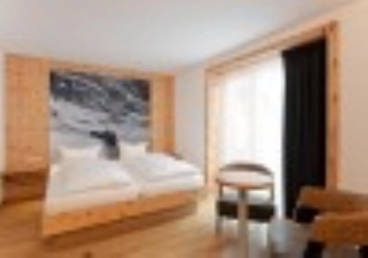 Bed in Mondschein Hotel & Chalet