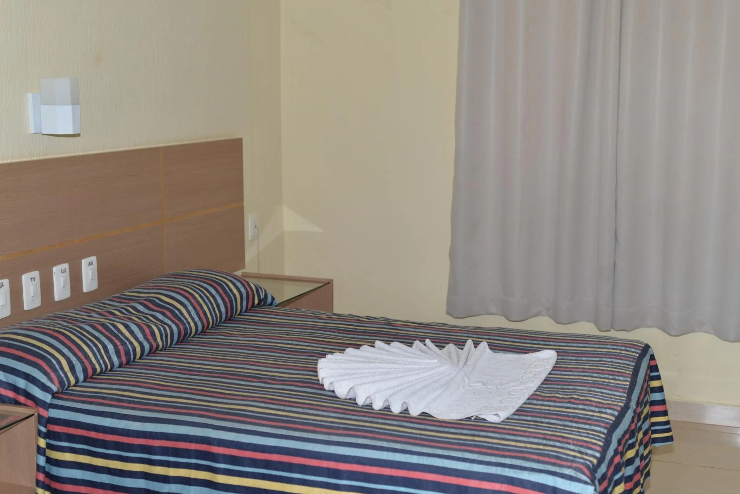 Bed in Fiesta Bahiana Club Hotel
