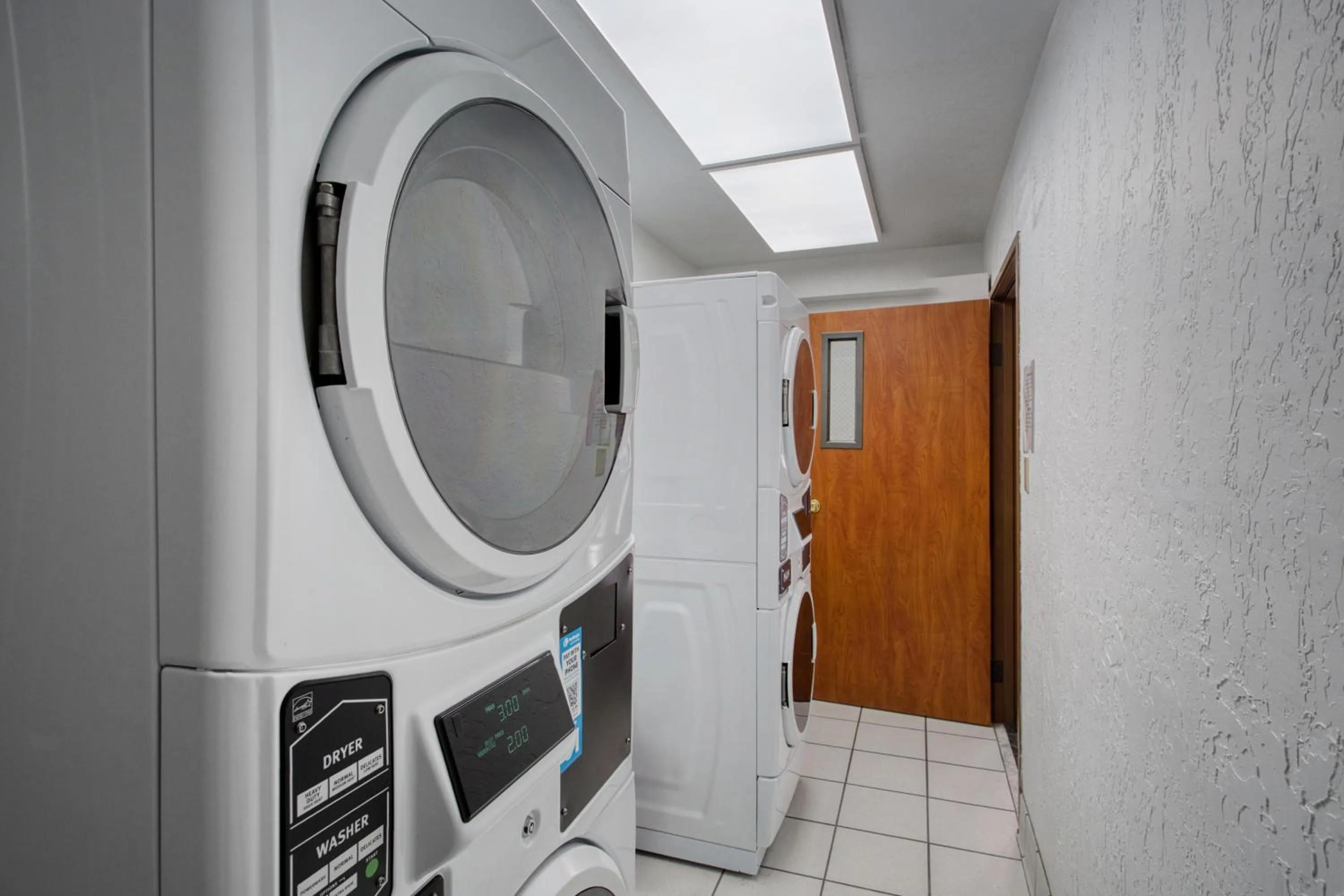 laundry in SureStay Plus Hotel by Best Western Price