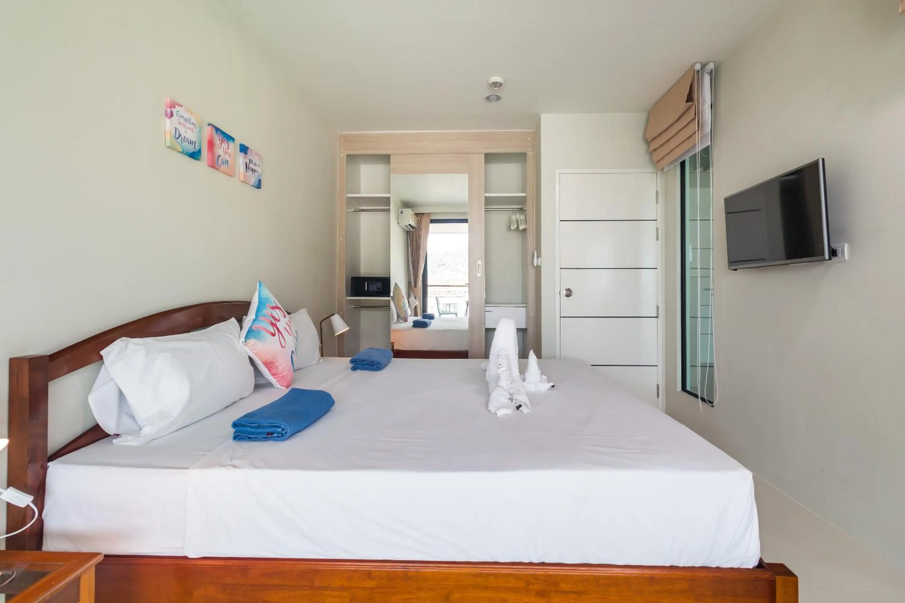 Bedroom, Bed in Apartments at The Bliss Condo by Lofty