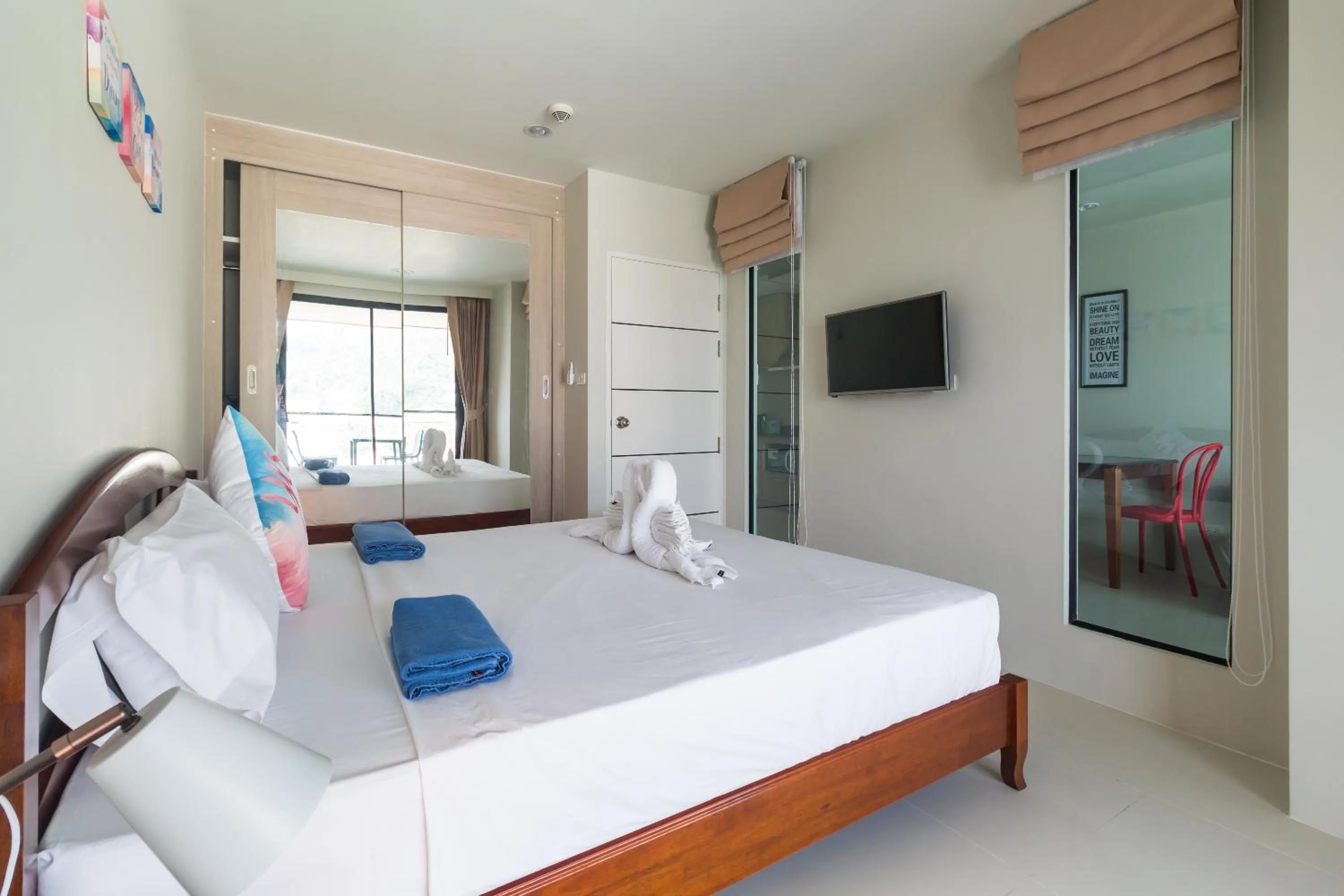 Bedroom, Bed in Apartments at The Bliss Condo by Lofty