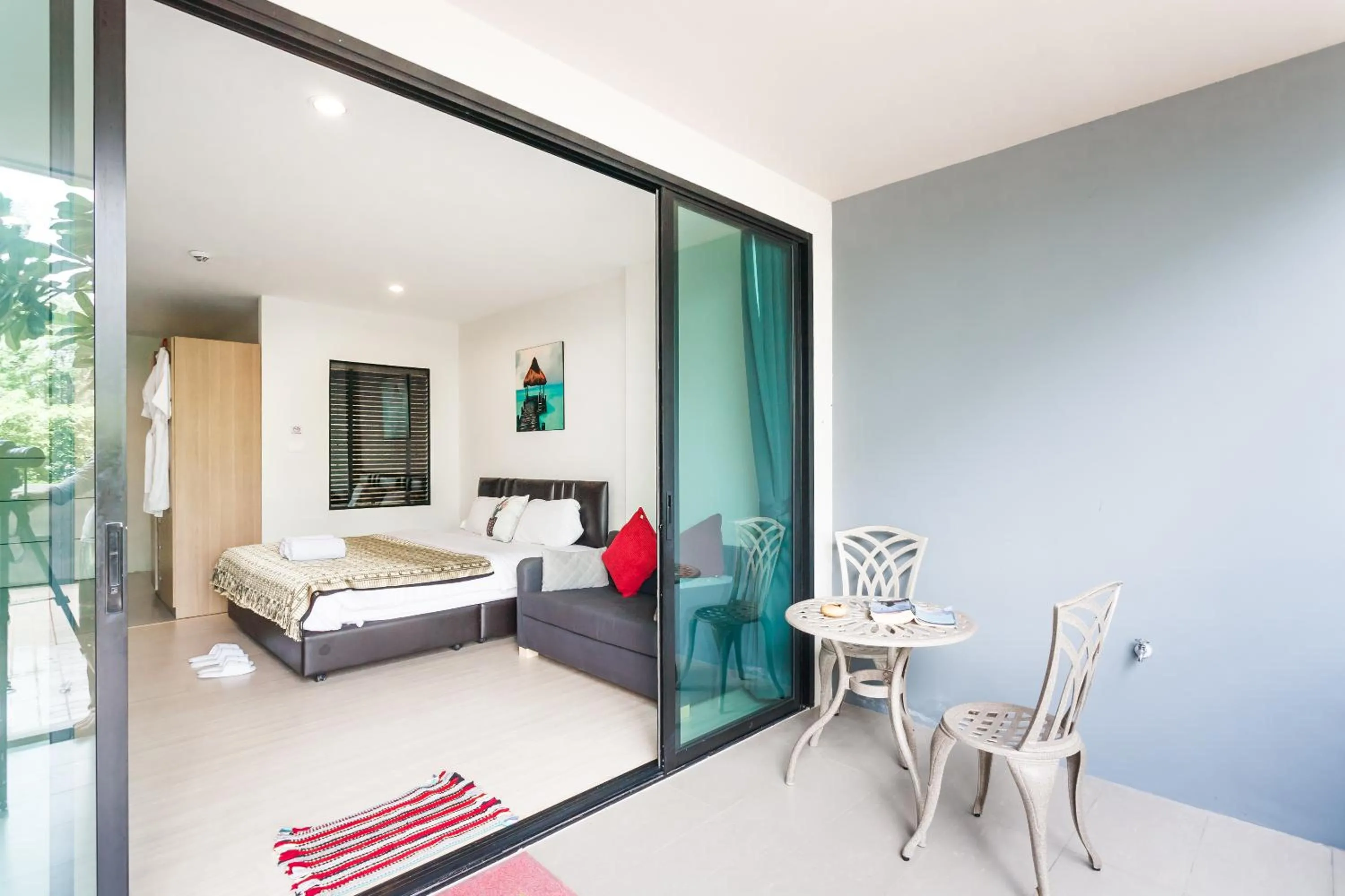 Balcony/Terrace, Bed in Apartments at The Bliss Condo by Lofty