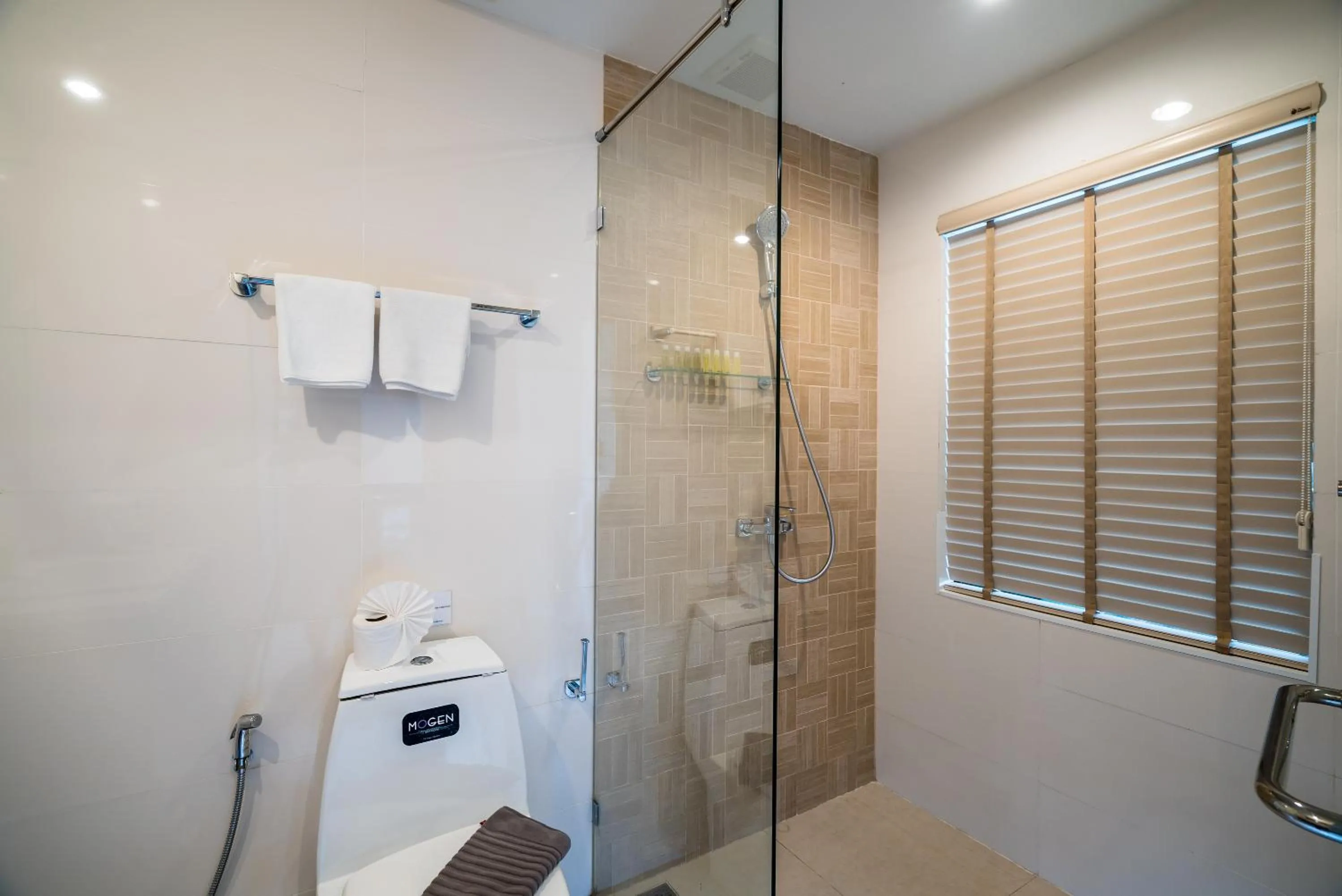 Shower in Apartments at The Bliss Condo by Lofty