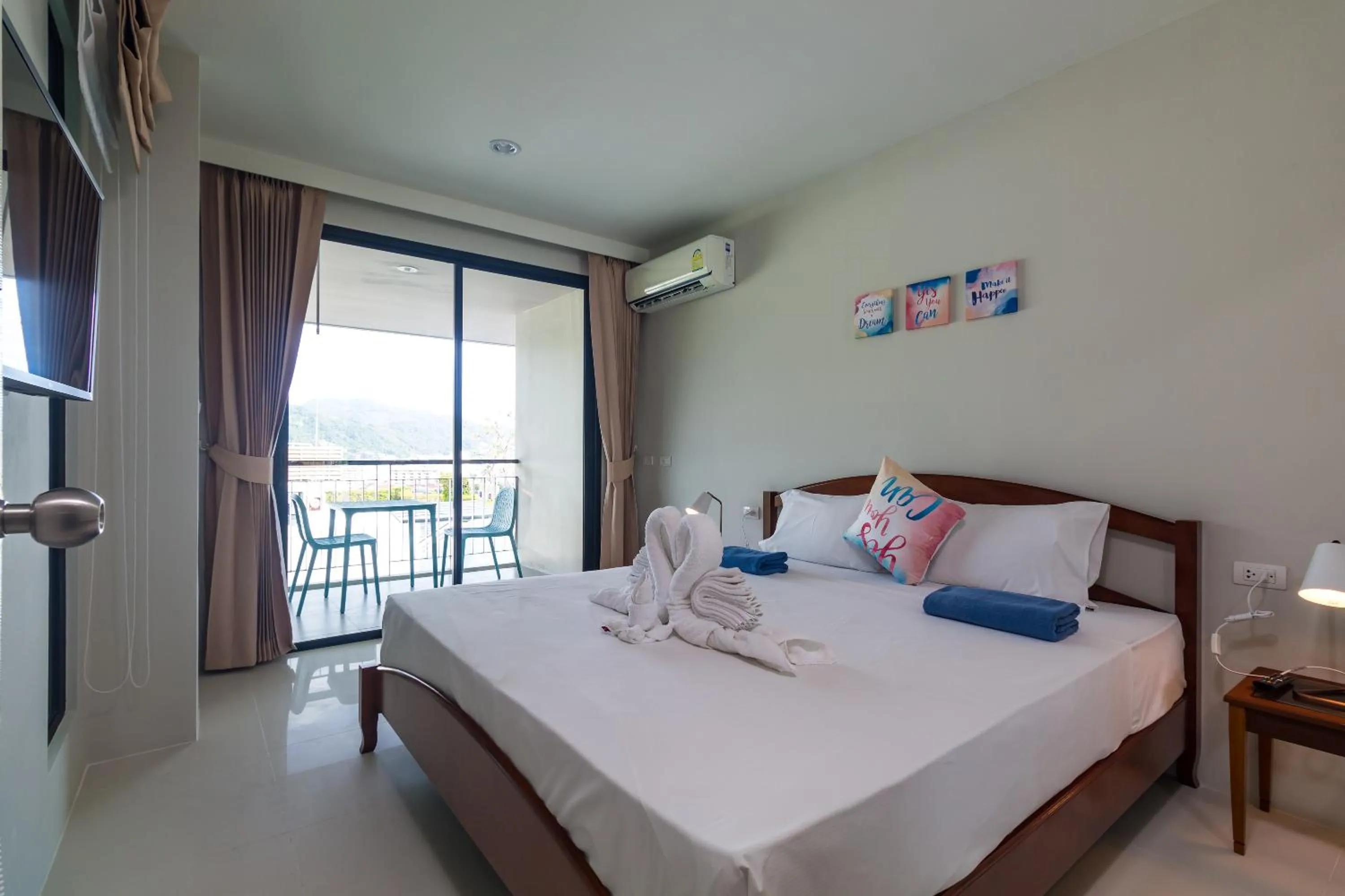 Balcony/Terrace, Bed in Apartments at The Bliss Condo by Lofty