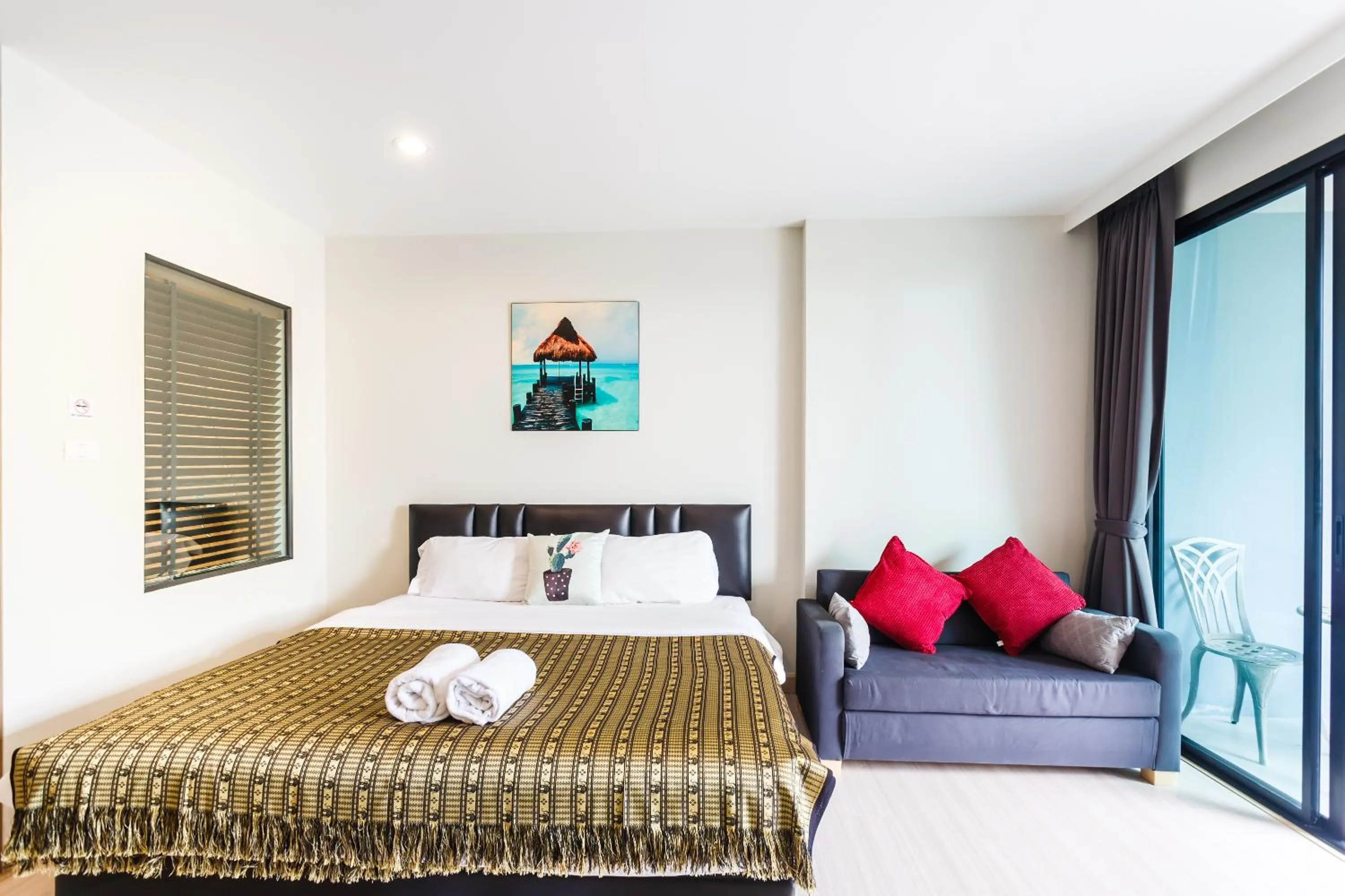 Balcony/Terrace, Bed in Apartments at The Bliss Condo by Lofty