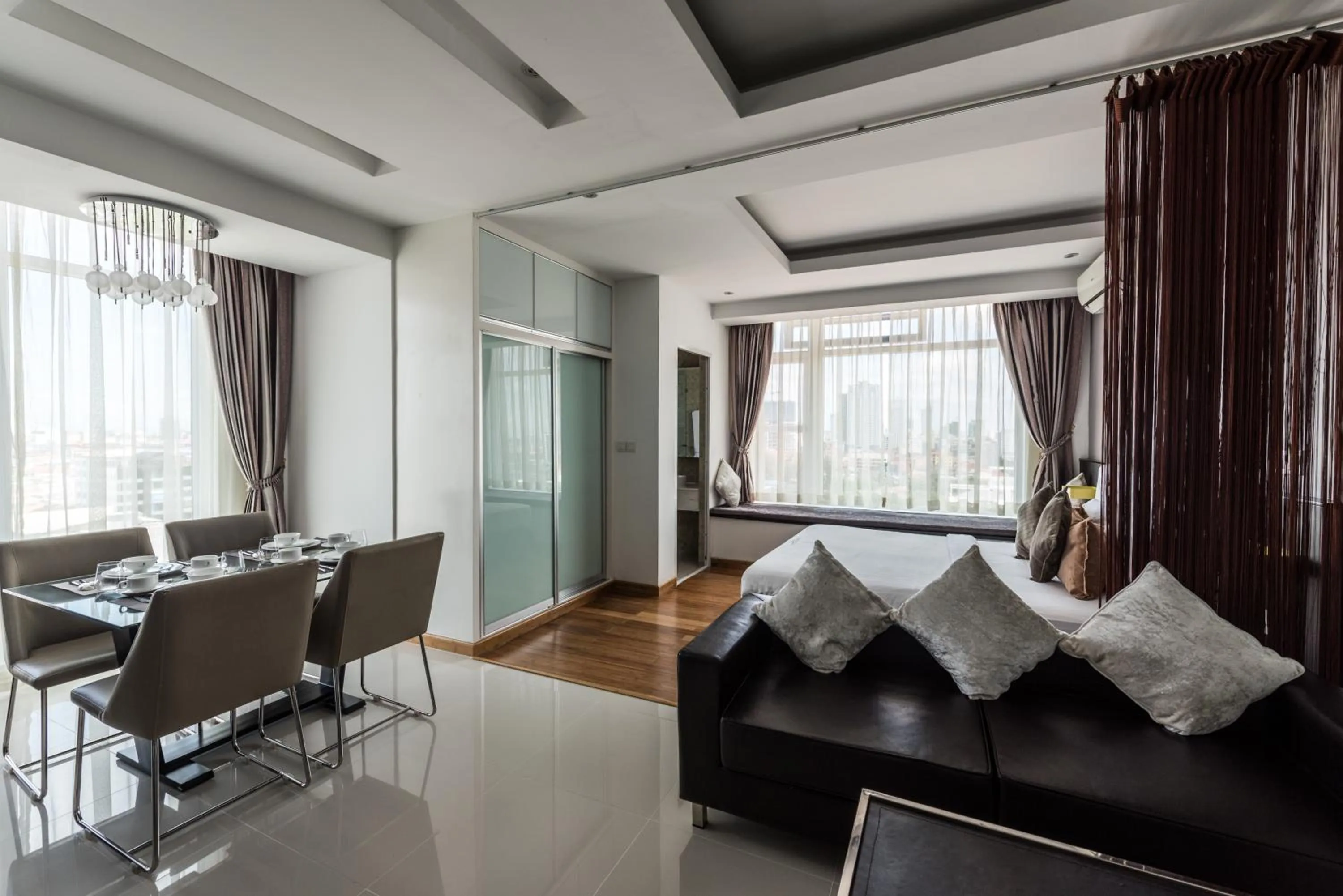 Living room, Bed in Naki Suites @ Silvertown