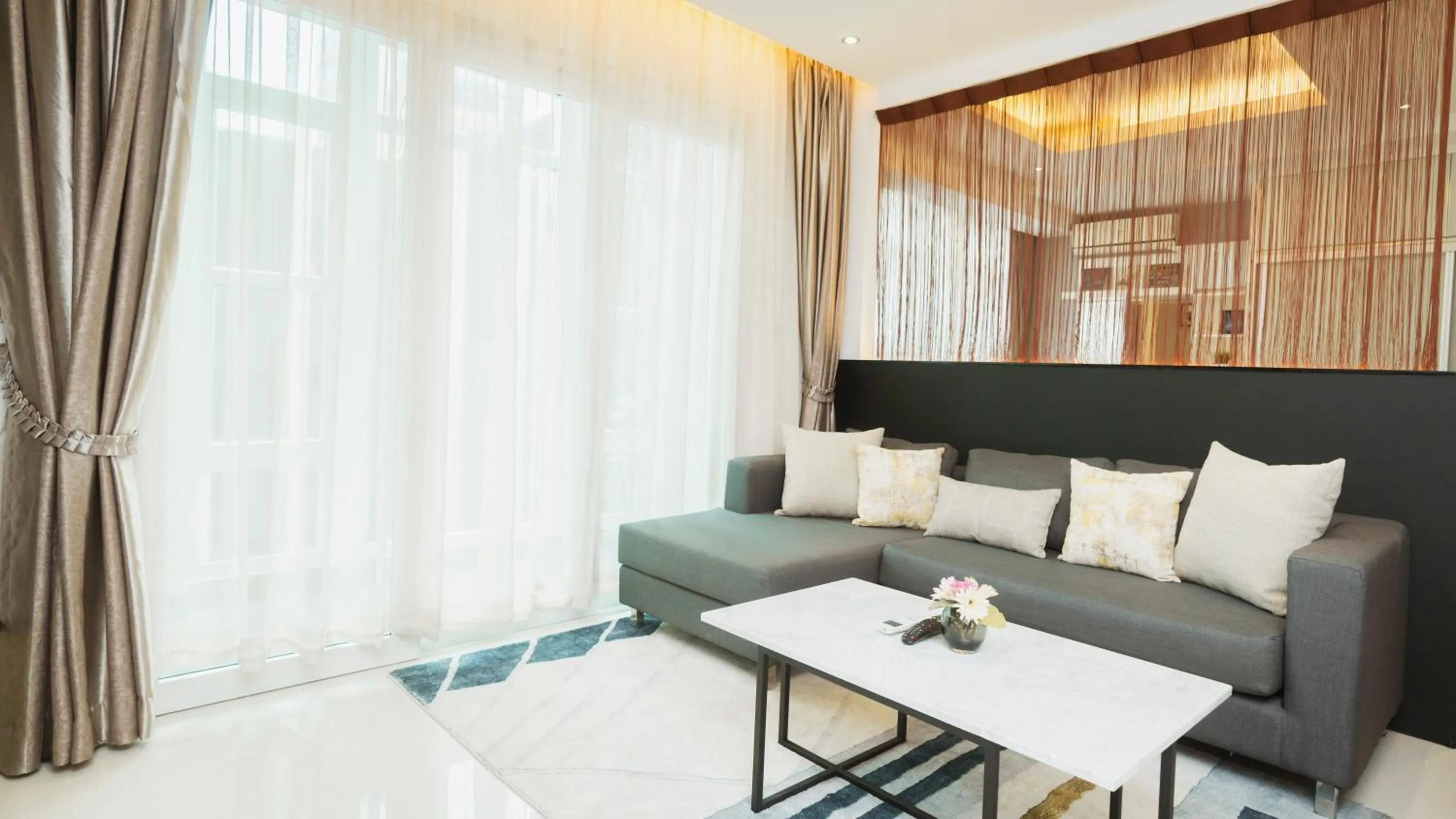 Living room, Bed in Naki Suites @ Silvertown