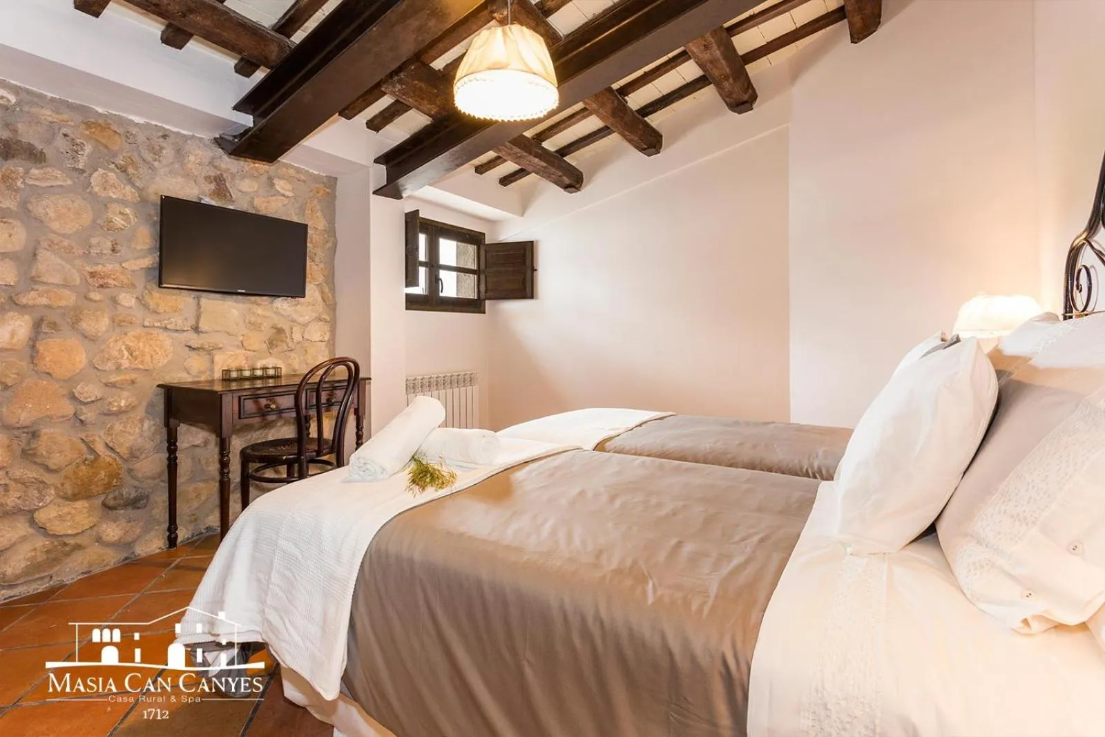 Bed in Masia Can Canyes & Spa