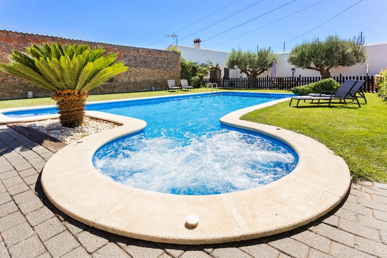 Swimming pool in Masia Can Canyes & Spa