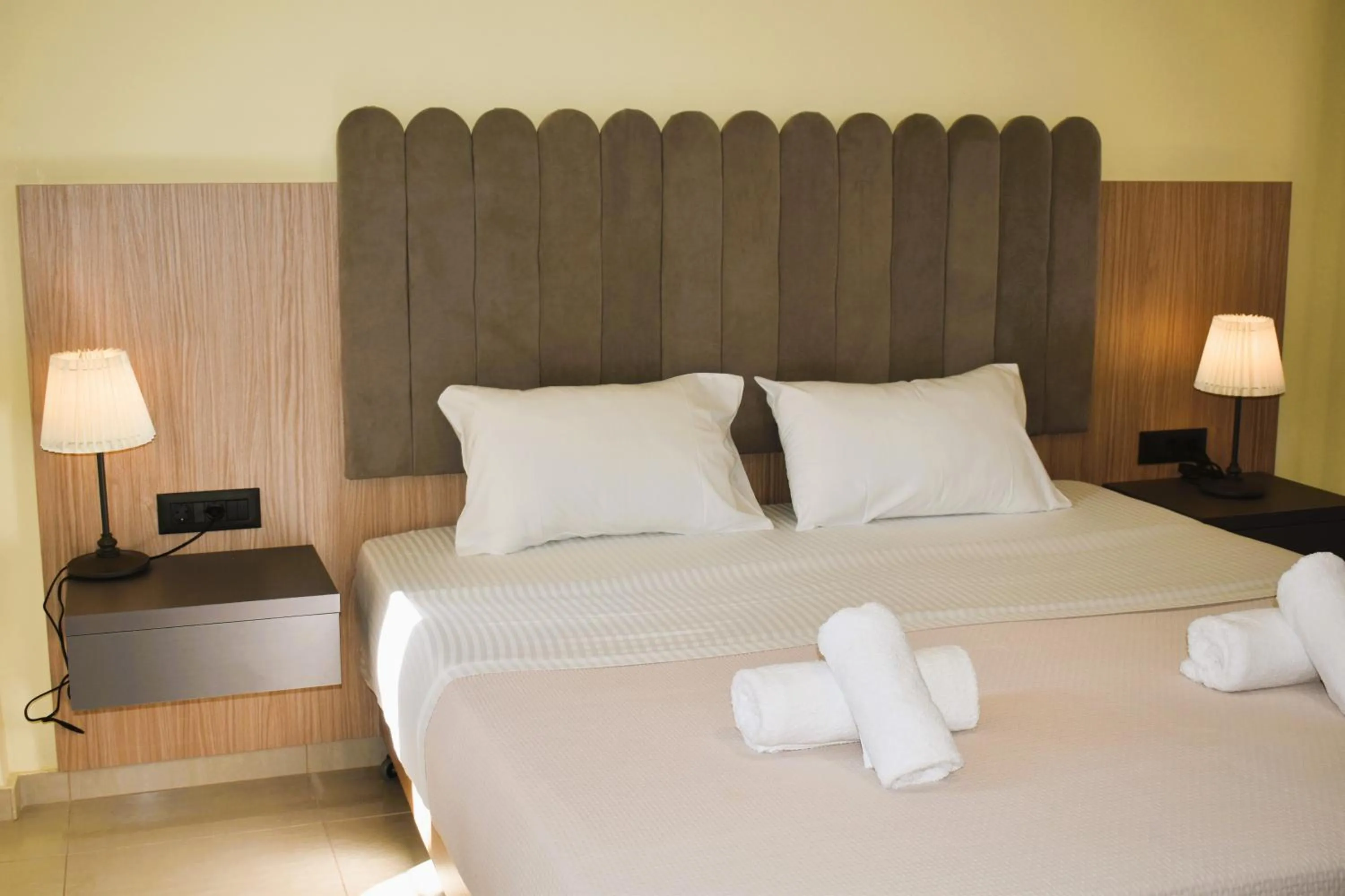 Bed in Eden Beach Hotel