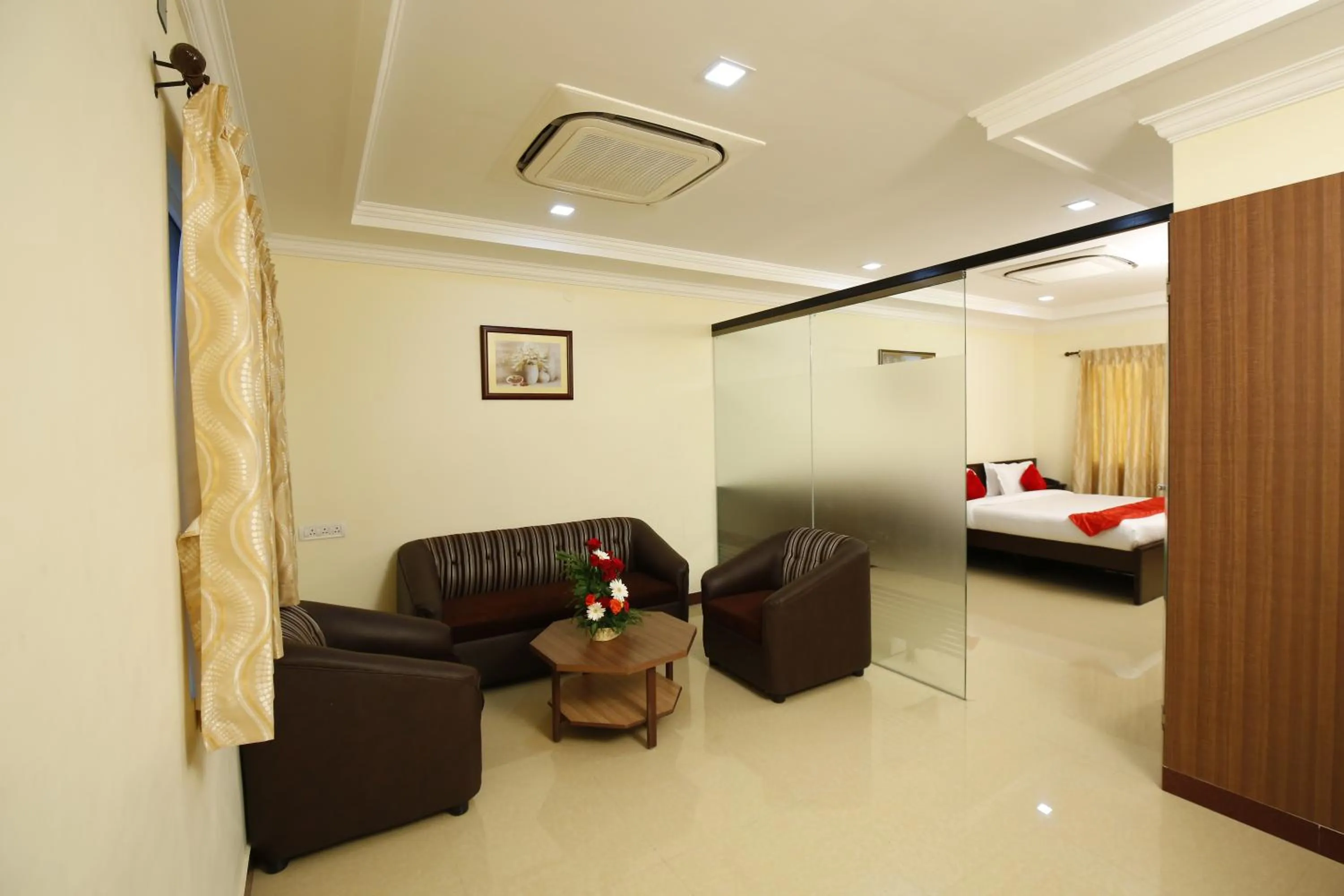 Seating area, Bed in Hotel Sree Devi Madurai