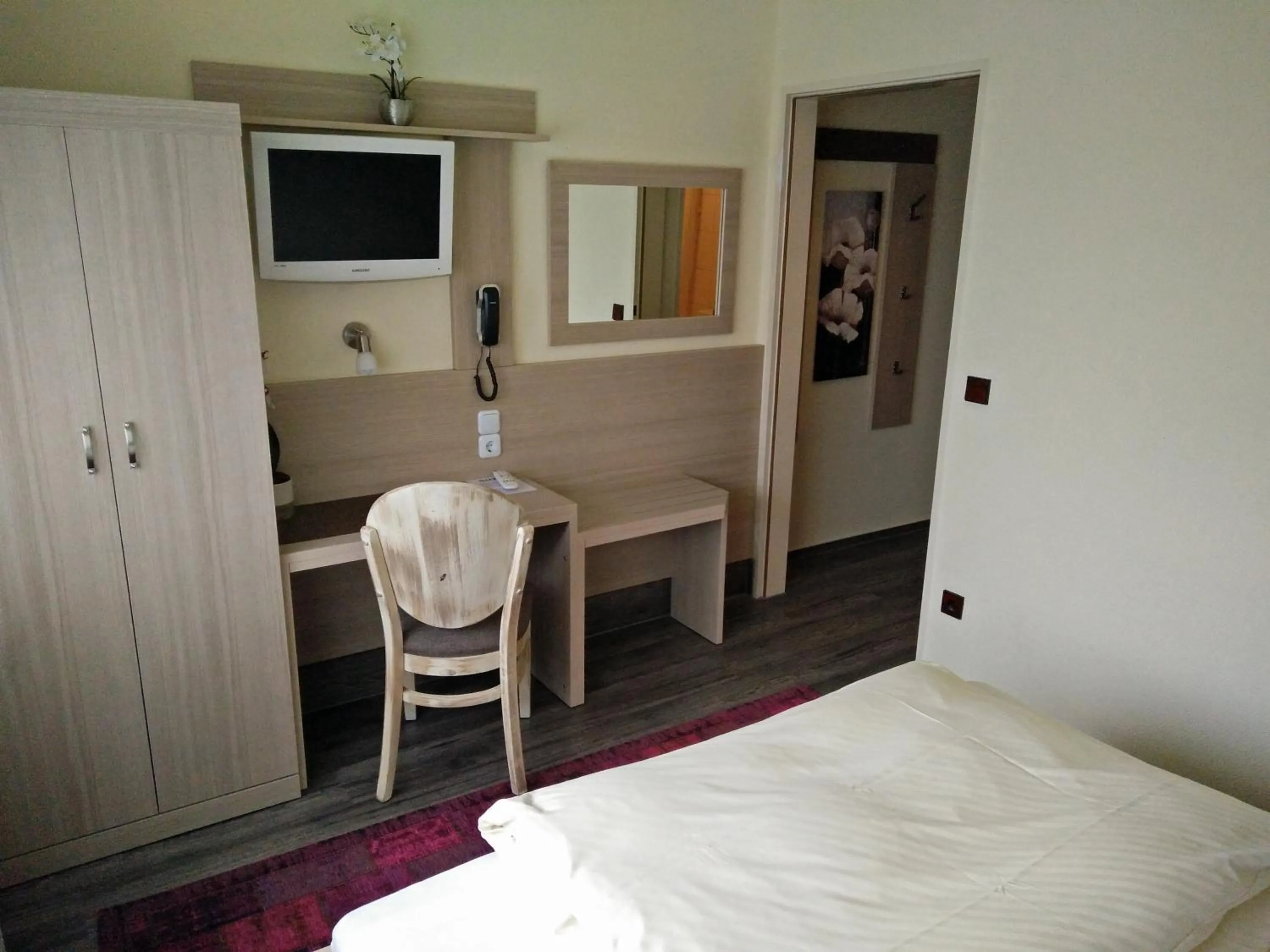 Seating area, Bed in Hotel Alfa