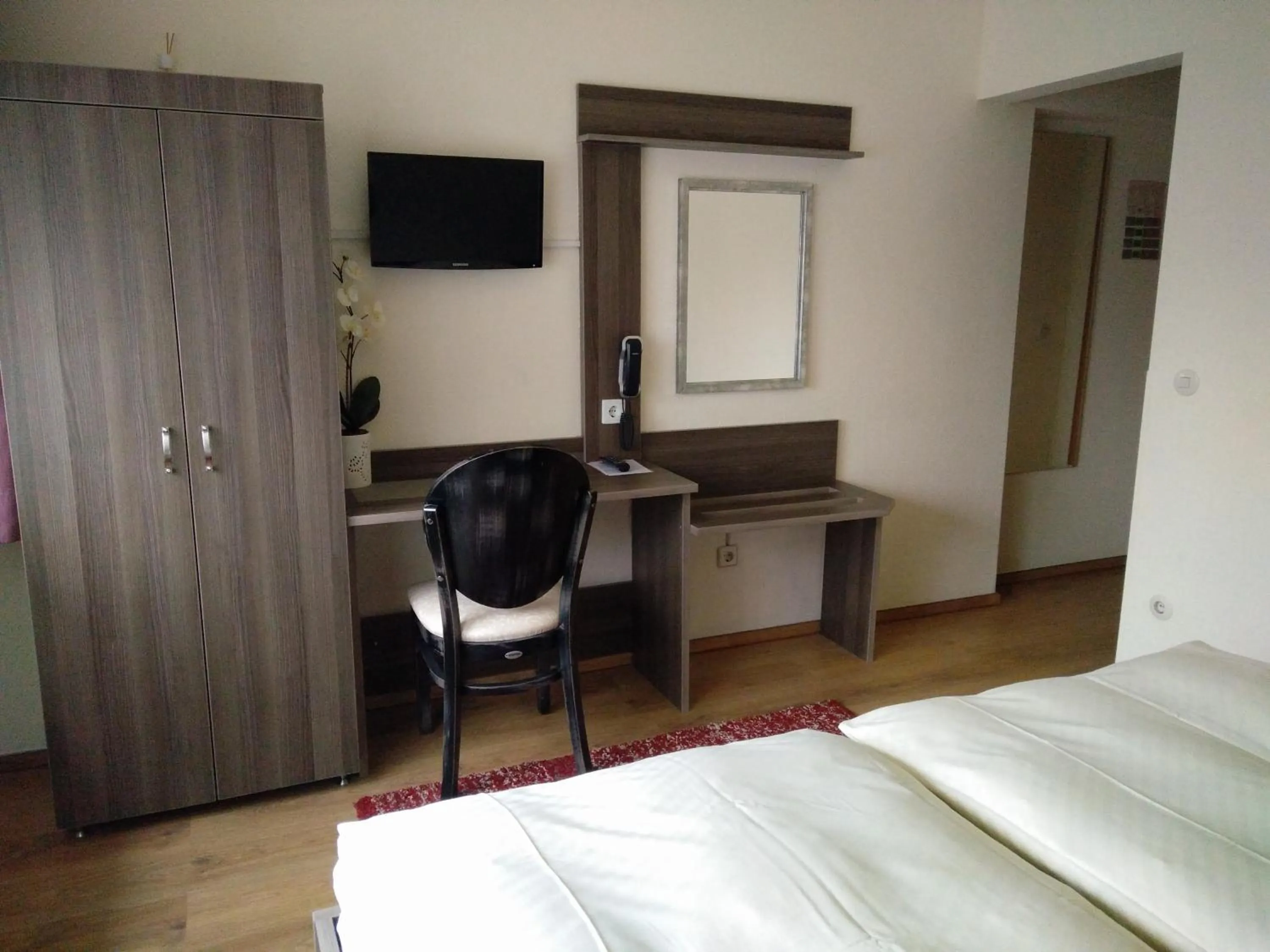 Seating area, Bed in Hotel Alfa