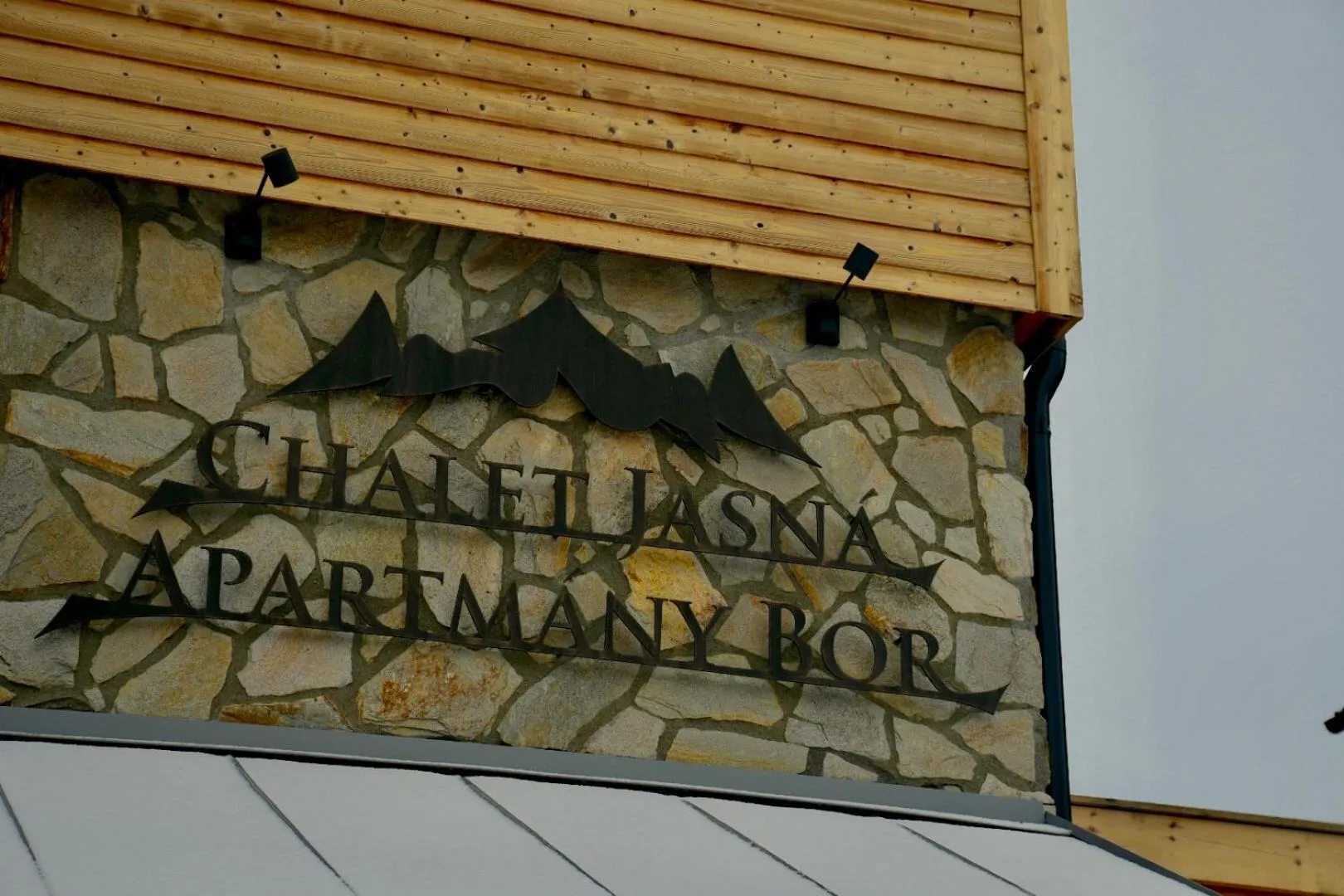 Property logo or sign in Chalety Jasná Apartmány Bor