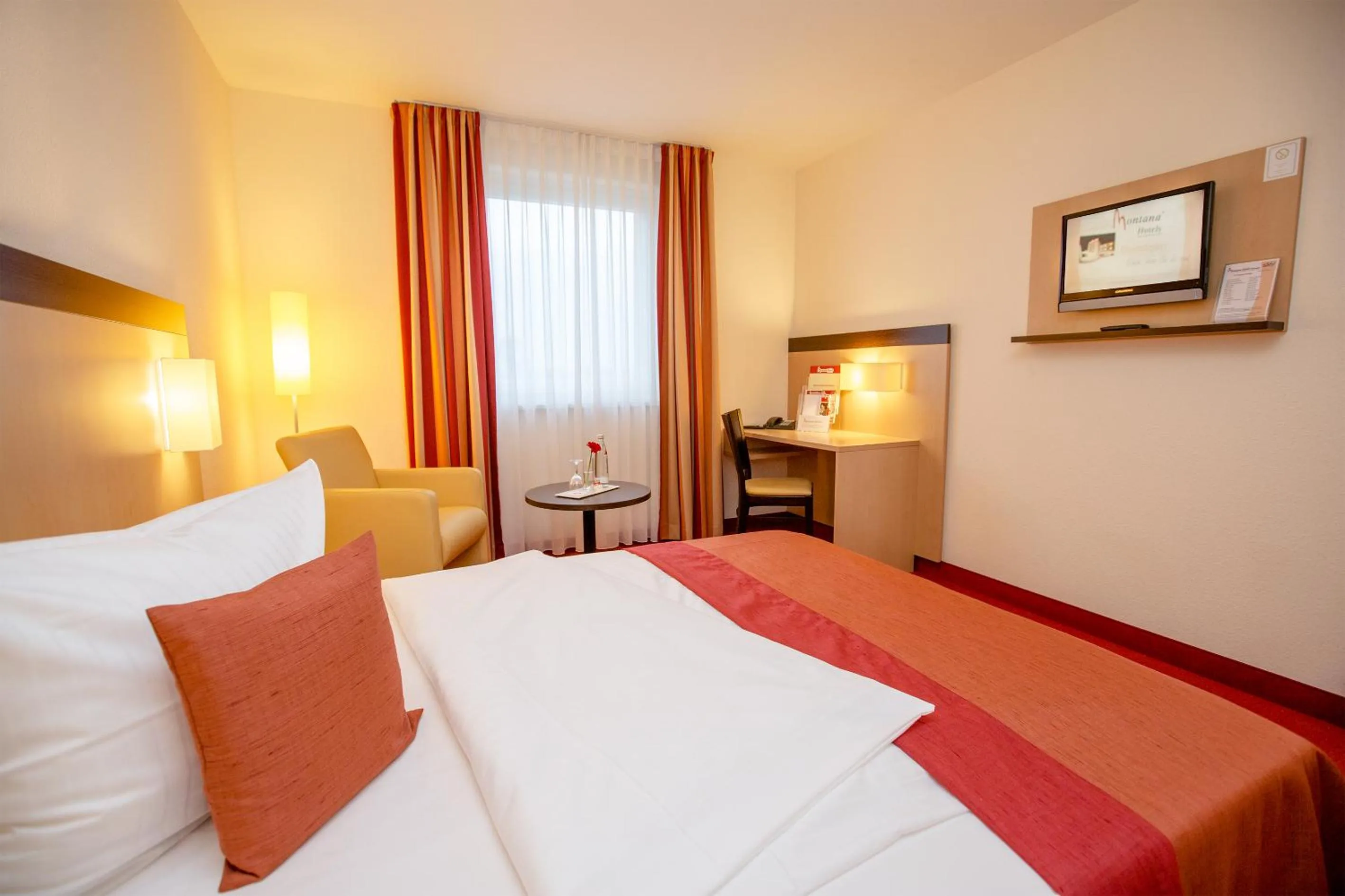 Photo of the whole room, Bed in Montana-Hotel Ellwangen