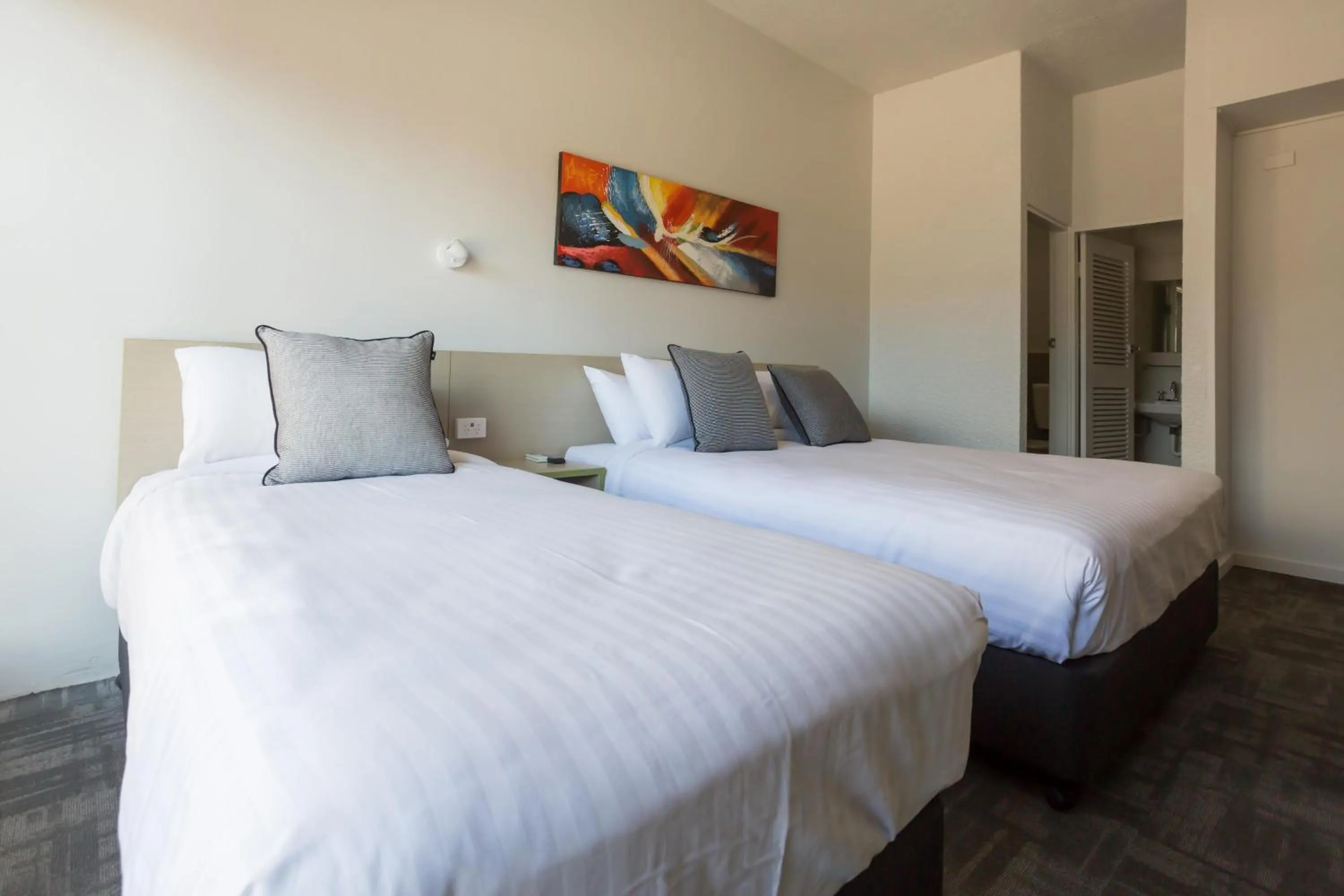 Bedroom, Bed in Nightcap at Emerald Star Hotel