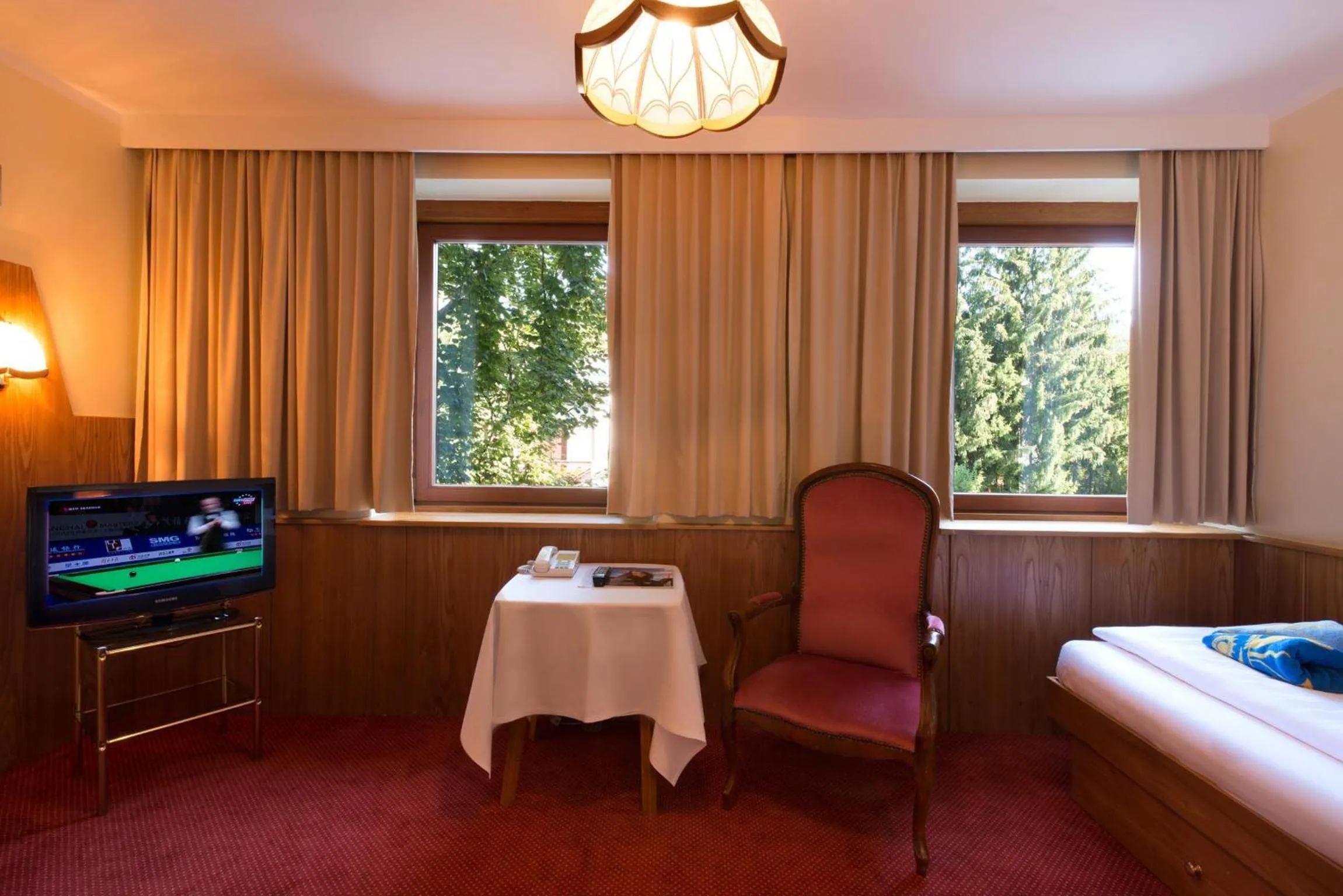 Seating area, Bed in Dermuth Hotels – Hotel Sonnengrund