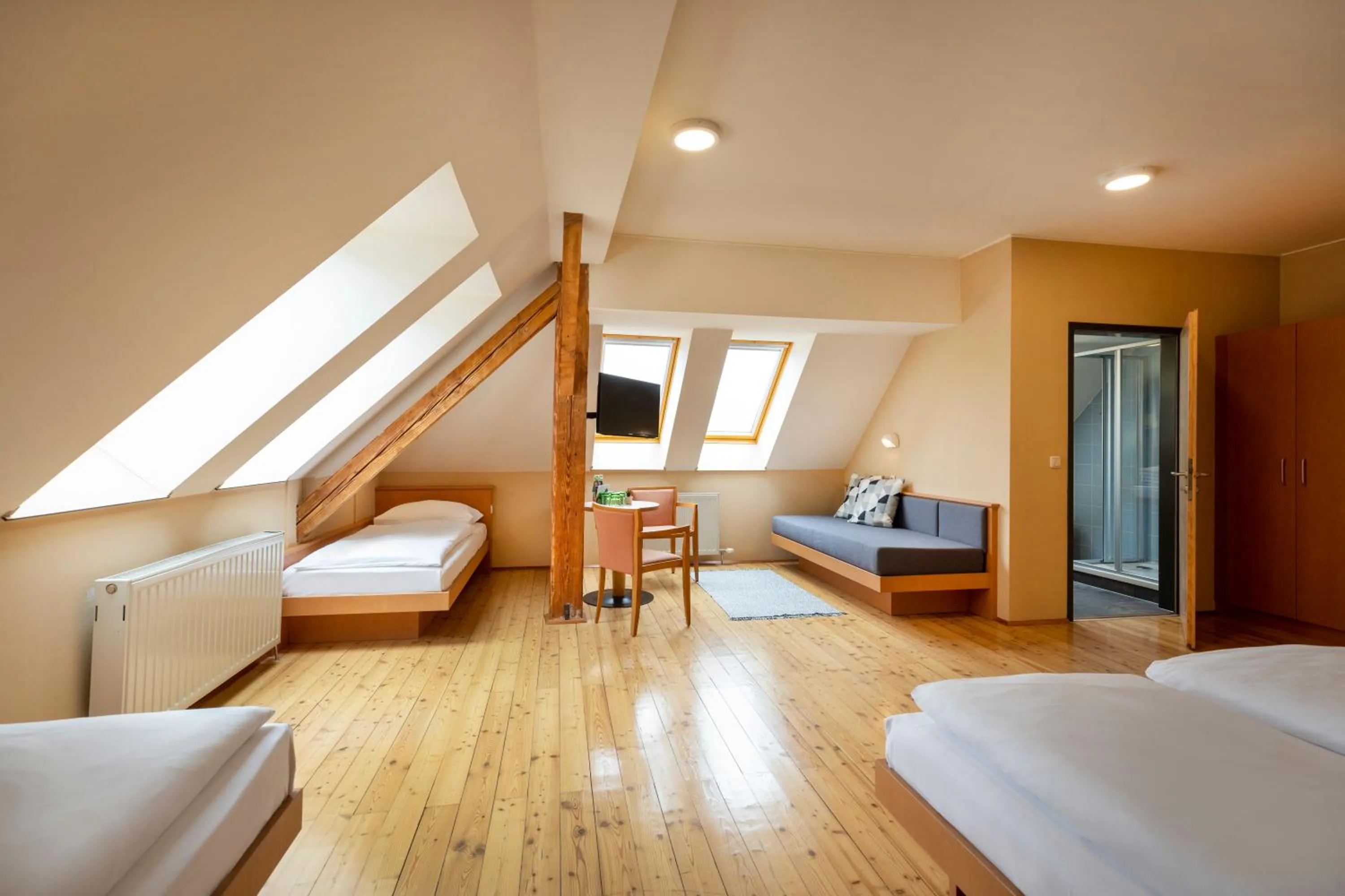 Living room, Bed in JUFA Hotel Judenburg - Self Check-In