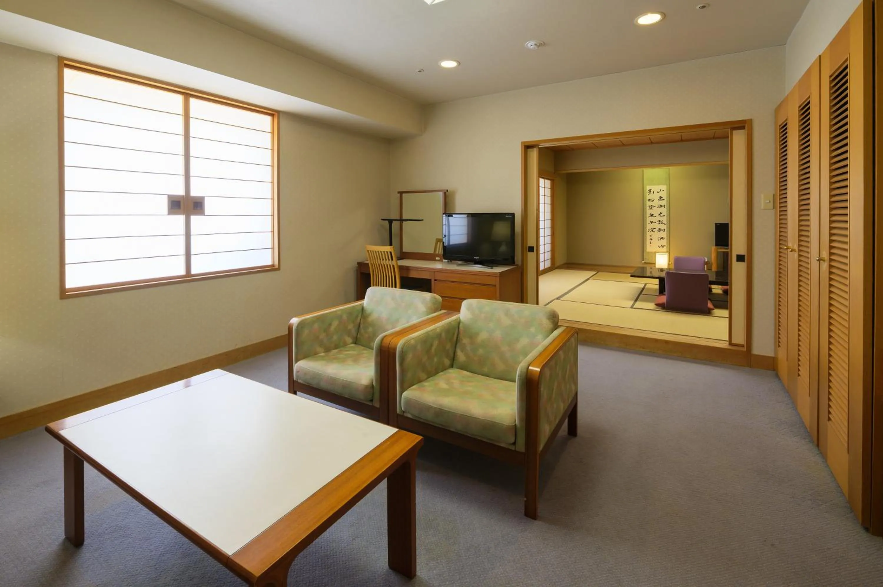 Living room, Bed in Hotel Aomori