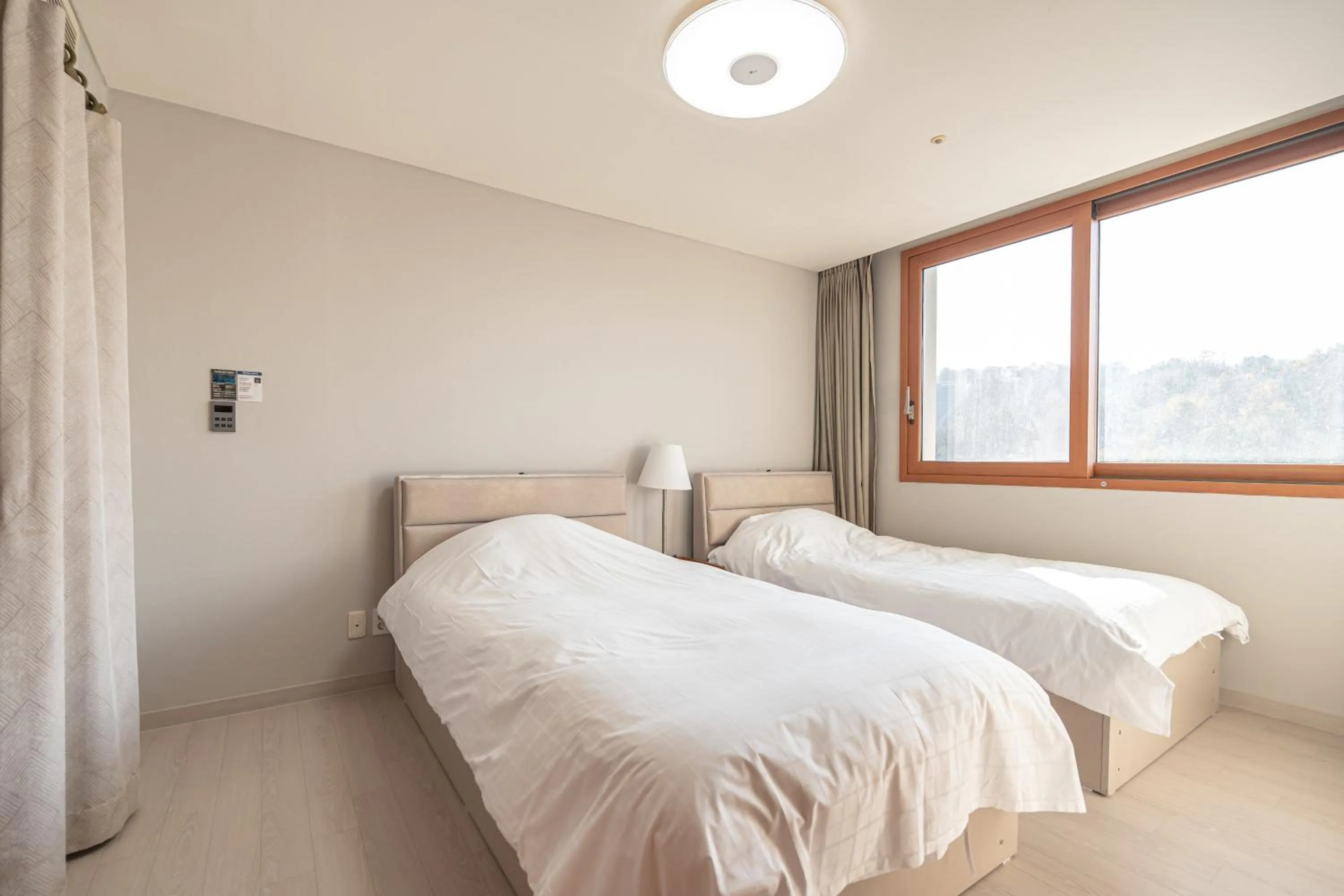 Bed in Elysian Gangchon Resort