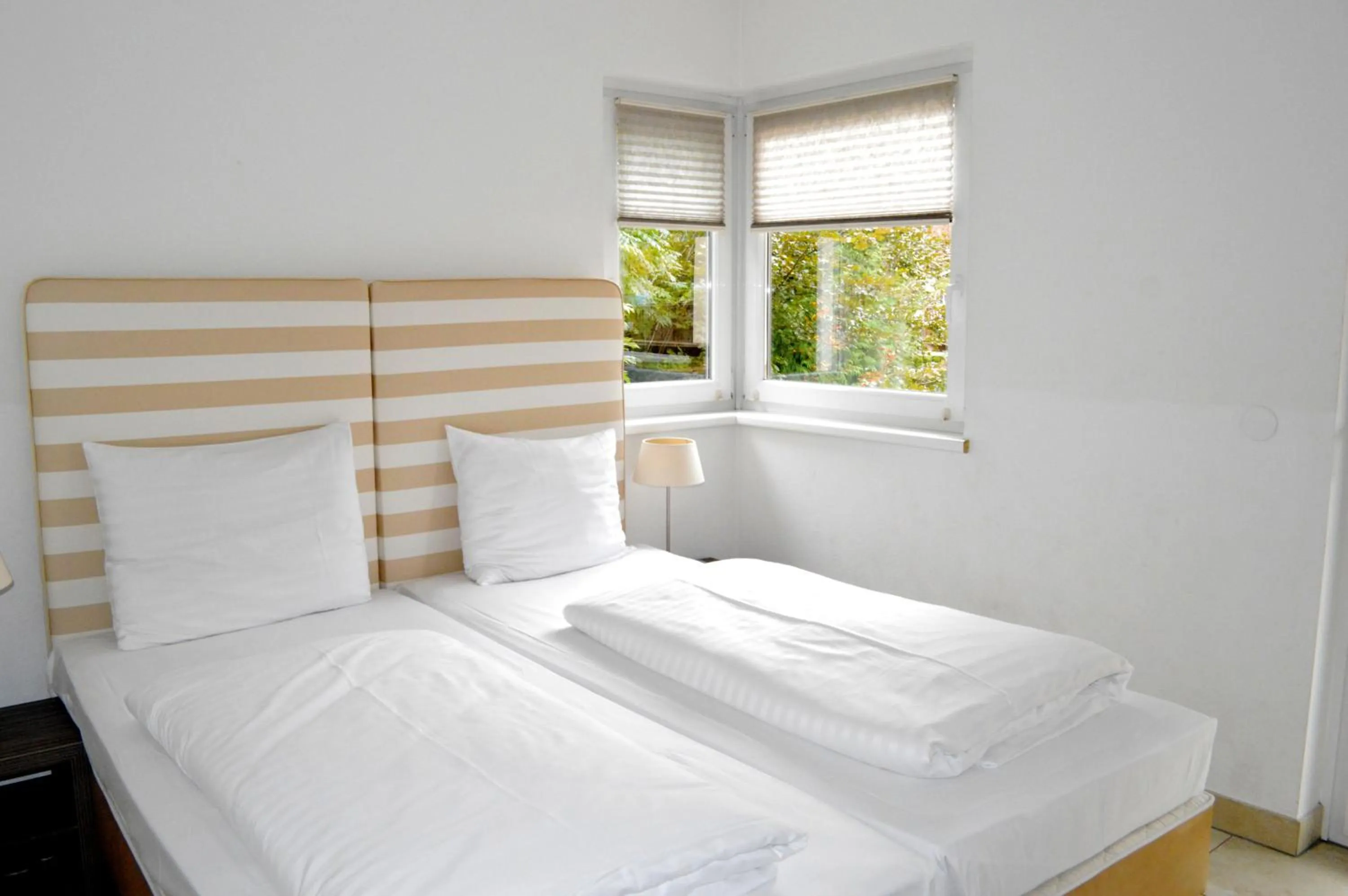 Bed in AvenidA Style Appartements by Alpin Rentals